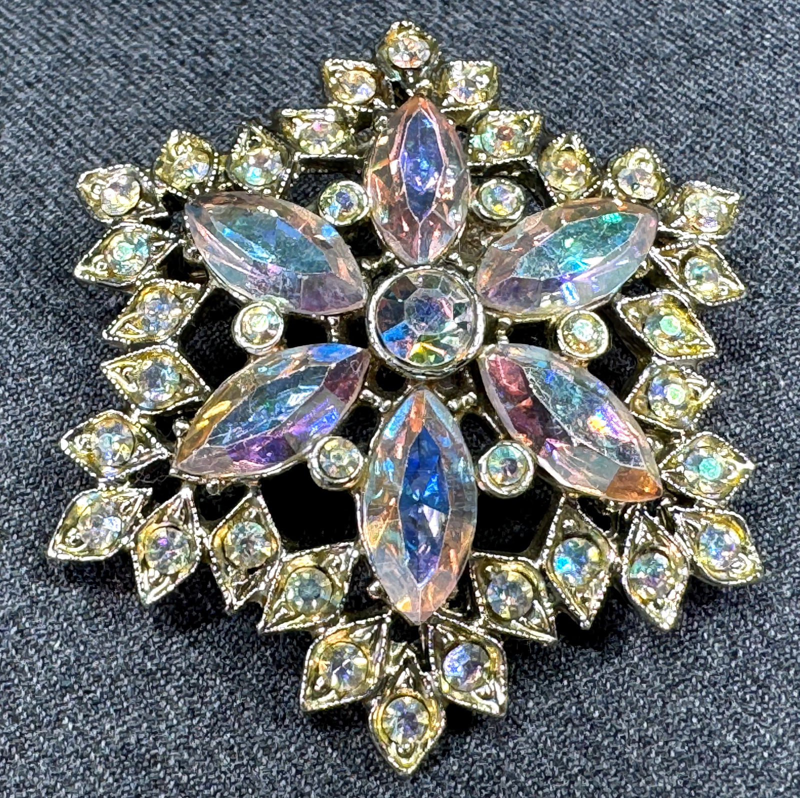 Vintage AB crystals goldtone flower pin brooch: Vintage AB crystals goldtone flower pin brooch. Unmarked. For measures please refer to the pictures taken with a measuring tape. Weight: 18 Grams. This is a NO RESERVE AUCTION: there are no hidden or 