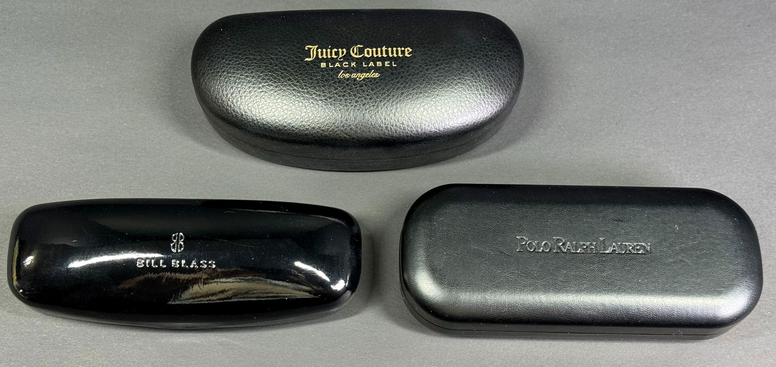 Bill Blass, Juicy Couture & Polo Ralph Lauren sunglasses cases .: Bill Blass, Juicy Couture & Polo Ralph Lauren sunglasses cases . For measures please refer to the pictures taken with a measuring tape. Weight: 390 Grams. This is a NO RESERVE AUCTION: there are no hi