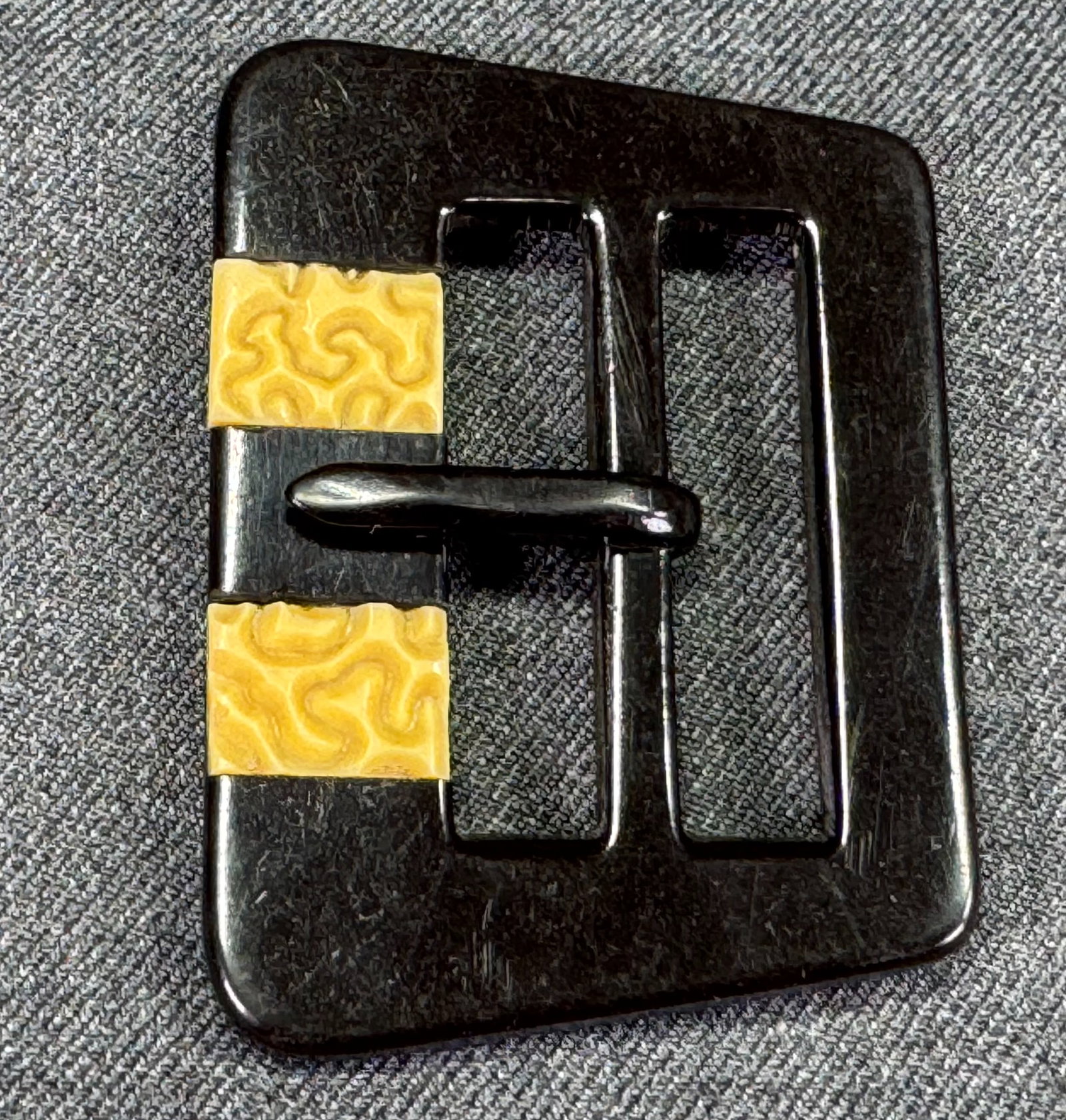 Vintage Czech art deco flapper inlaid color celluloid applejuice bakelite belt buckle: Vintage art deco carved black & confetti applejuice cab galalith belt buckle. For measures please refer to the pictures taken with a measuring tape. Galalith (milk stone) is a registered trademark, pa