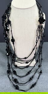 Vintage faceted black glass beads multistrands necklace. Flower beaded clasp: Vintage faceted black glass beads multistrands necklace. Flower beaded clasp . Unmarked. For measures please refer to the pictures taken with a measuring tape. Weight: 130 Grams. IN HOUSE Estimated* s