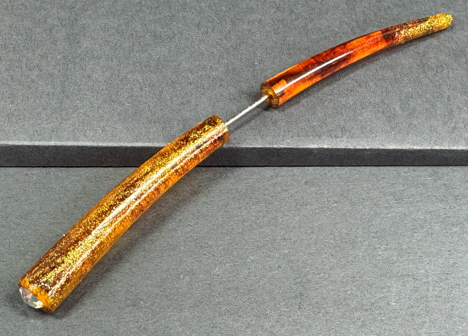 Vintage AB crystal golden accents marbled brown plastic jabot pin.: Vintage AB crystal golden accents marbled brown plastic jabot pin. Unmarked. For measures please refer to the pictures taken with a measuring tape. Weight: 9 Grams. This is a NO RESERVE AUCTION: there
