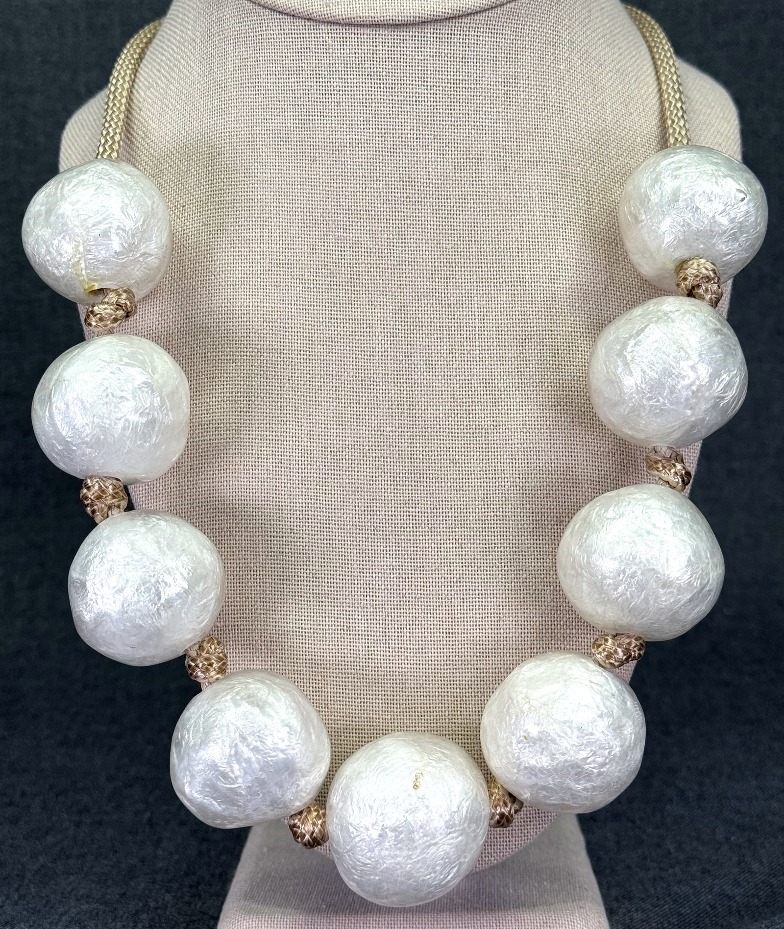 Vintage 60s Italian rough white plastic oversized beads necklace. Hand knotted in between.: Vintage 60s Italian rough white plastic oversized beads necklace. Hand knotted in between. Marbled brown toggle plastic clap. Unmarked. For measures please refer to the pictures taken with a measuring