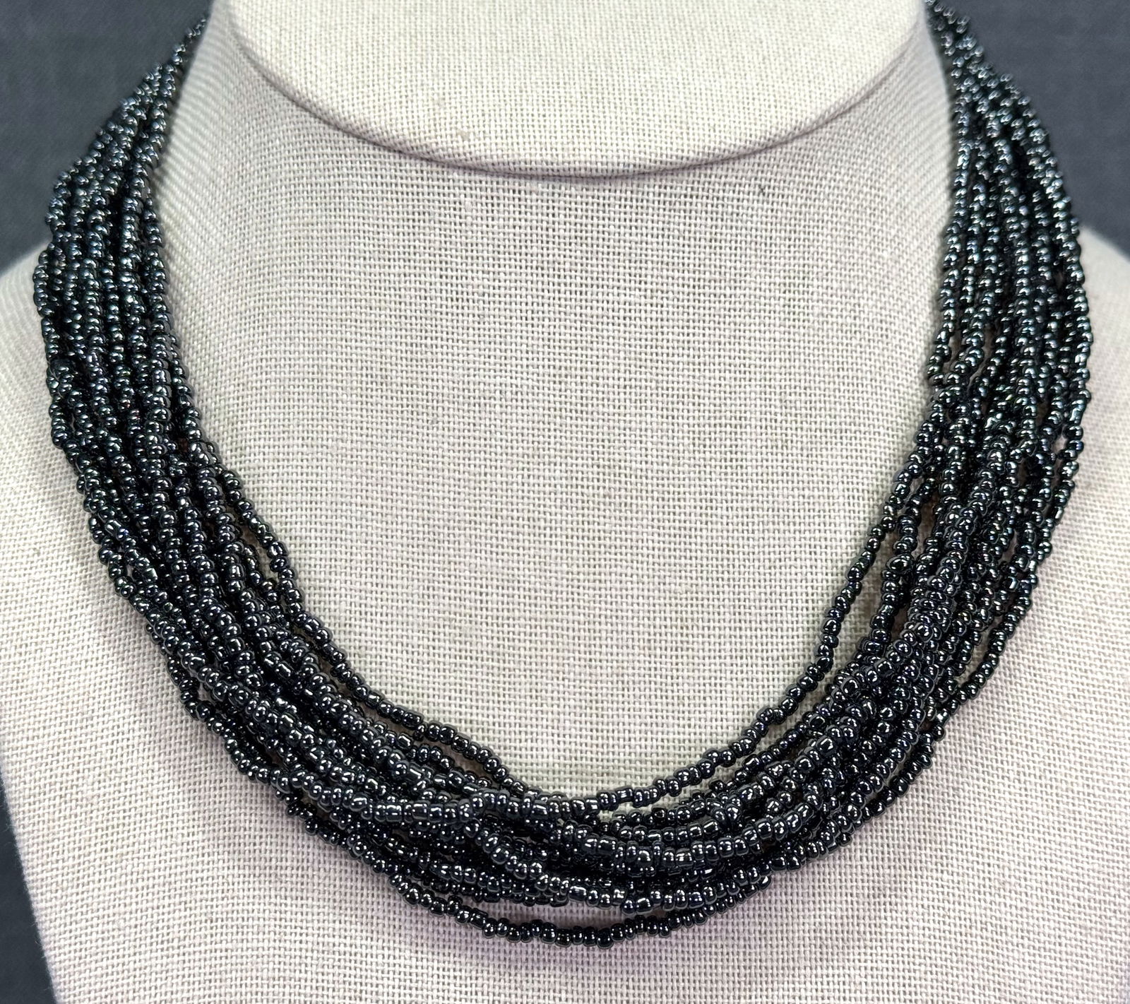 Vintage iridescent dark gray glass beads multi strand necklace. Goldtone clasp (1 of 4)