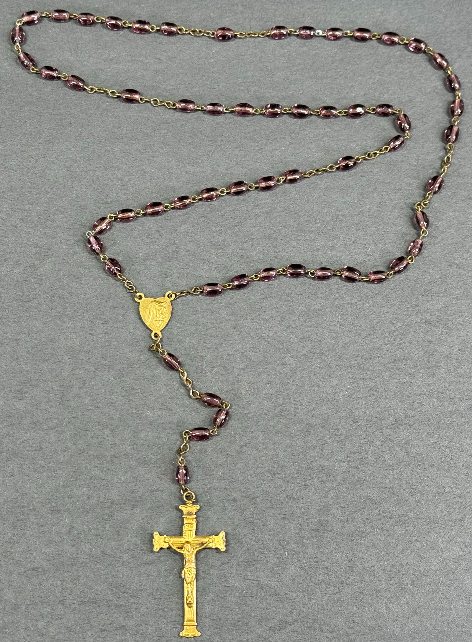 Vintage Czech goldtone metal Crucifix Our Lady & IHS medal rose lilac glass rosary.: Vintage Czech goldtone metal Crucifix Our Lady & IHS medal rose lilac glass rosary. Marked Made in Cechoslov. Original patina. For measures please refer to the pictures taken with a measuring tape. We