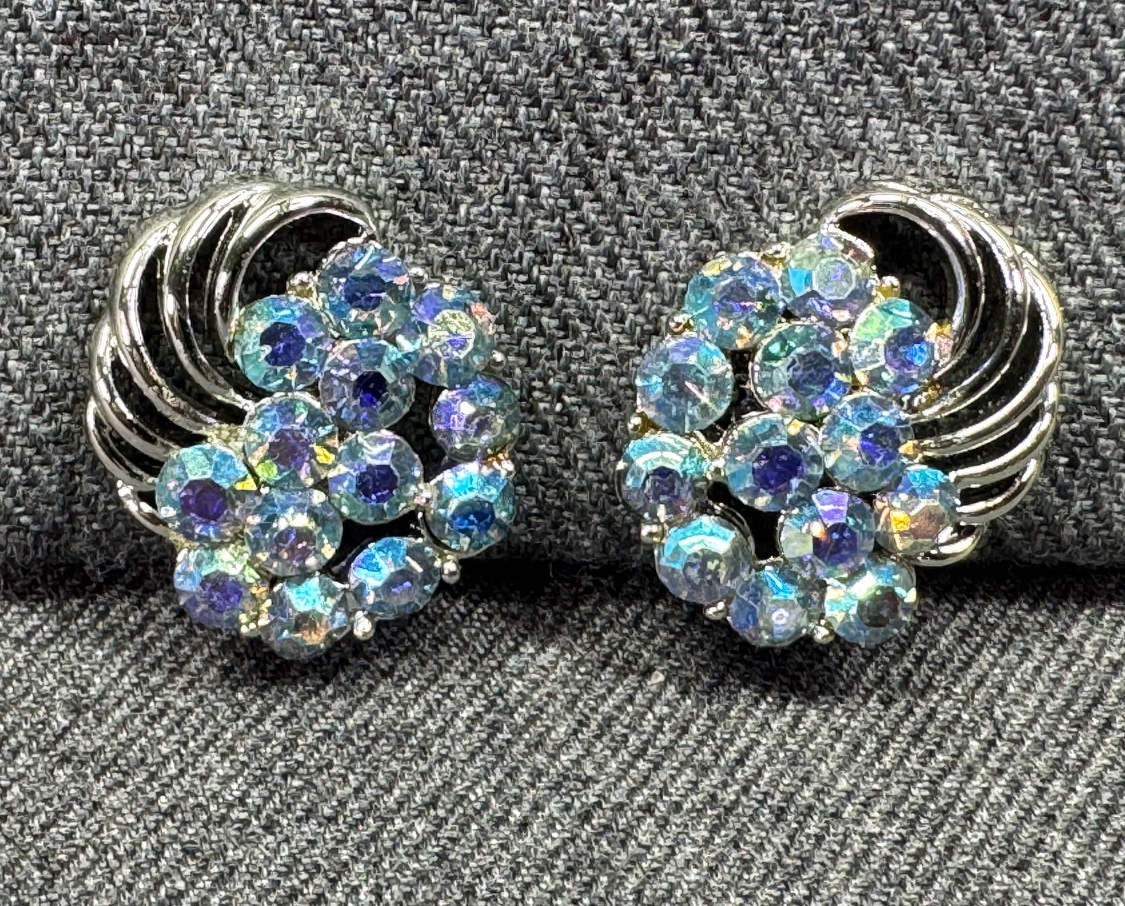 Vintage Coro AB crystals silvertoned metal clip earrings: Vintage Coro AB crystals silvertoned metal clip earrings. Marked. For measures please refer to the pictures taken with a measuring tape. Weight: 10 Grams. IN HOUSE Estimated* shipping and handling cos