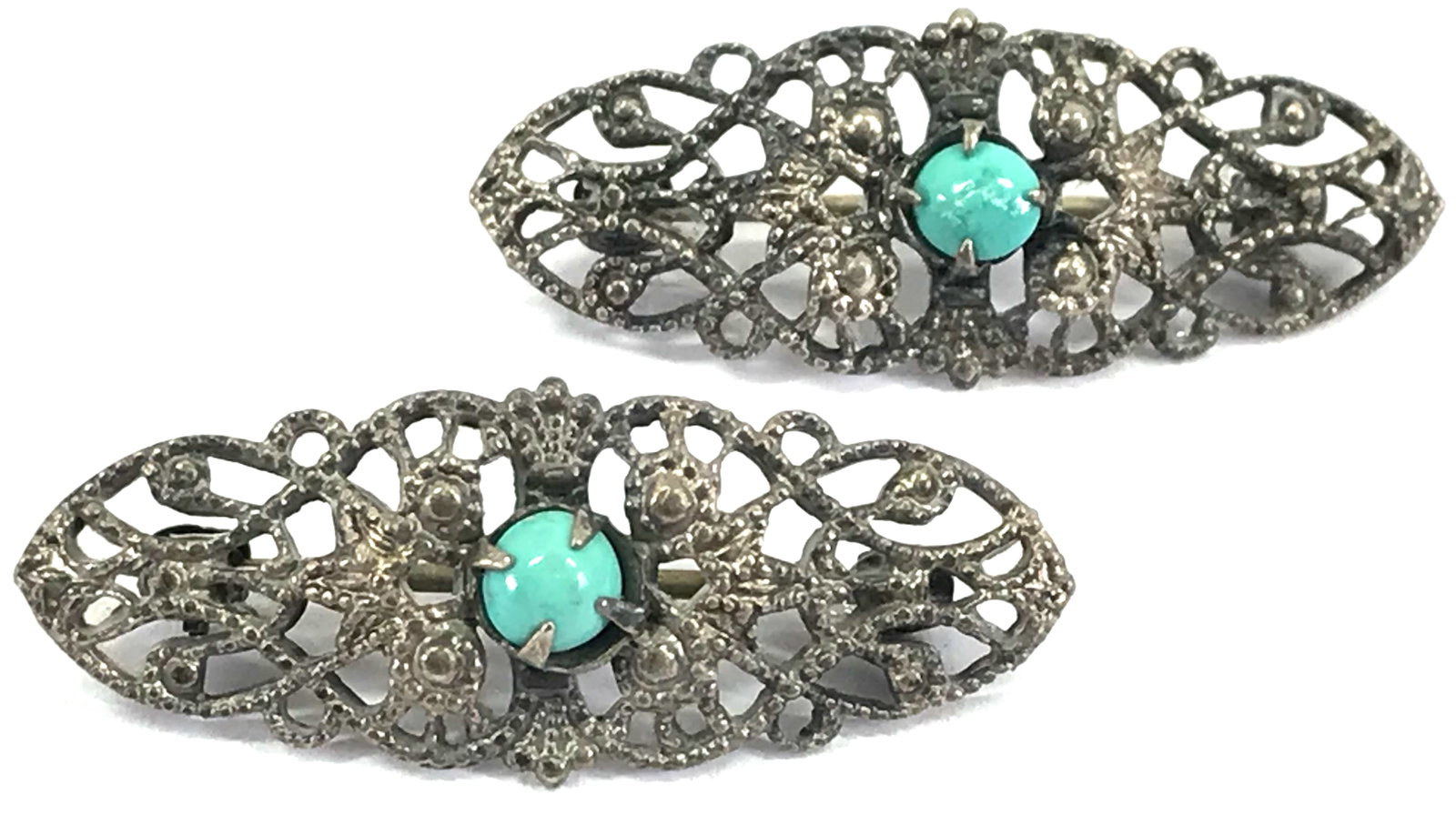 Vintage Chinese Turquoise Filigree Silvertoned Pin Brooches. Lot of 2: Vintage Chinese Turquoise Stone Cab Filigree Silvertoned Metal Pin Brooches. Lot of 2 . Unmarked. For measures please refer to the picture taken with a measuring tape. Weight: 2 Grams . This is a NO R