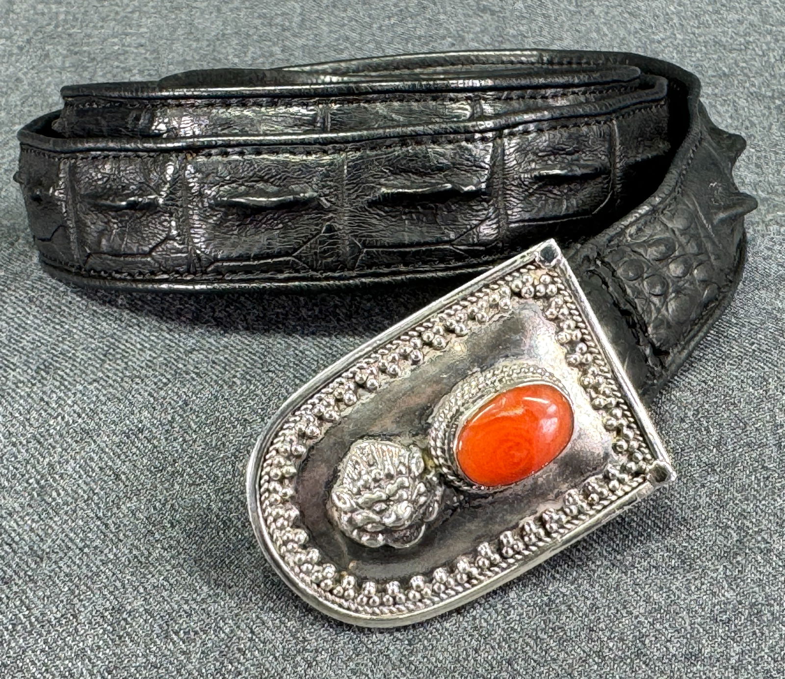 Vintage Southwestern coral cab silver buckle black crocodile belt.: Vintage Southwestern coral cab silver buckle black crocodile belt. Buckle is unmarked and strap is marked Genuine Crocodile skin. For measures please refer to the pictures taken with a measuring tape.