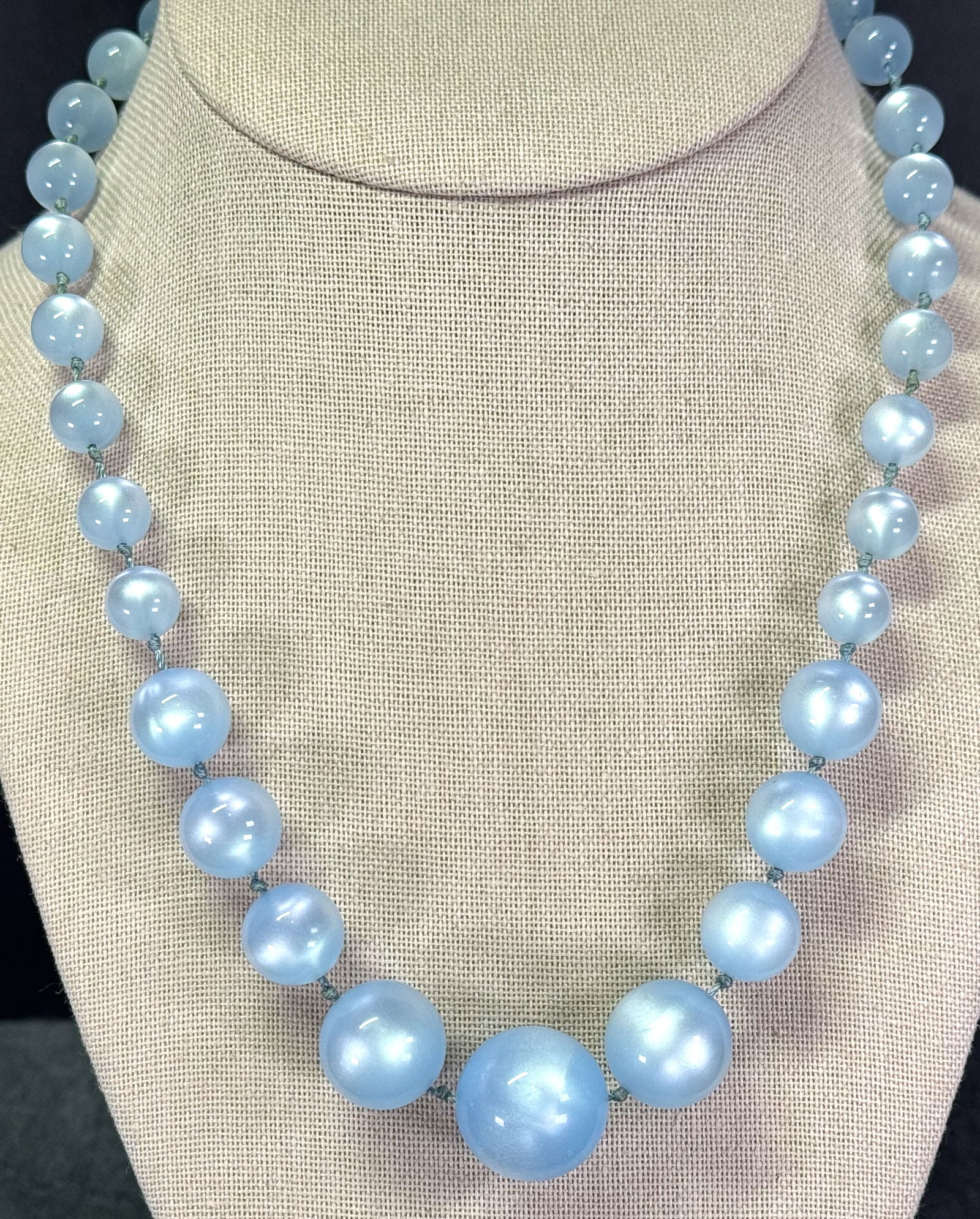 Vintage sky blue moonglow lucite graduated beads collar necklace: Vintage sky blue moonglow lucite graduated beads collar necklace. Hand knotted in between. Unmarked. For measures please refer to the pictures taken with a measuring tape. Weight: 27 Grams. IN HOUSE E