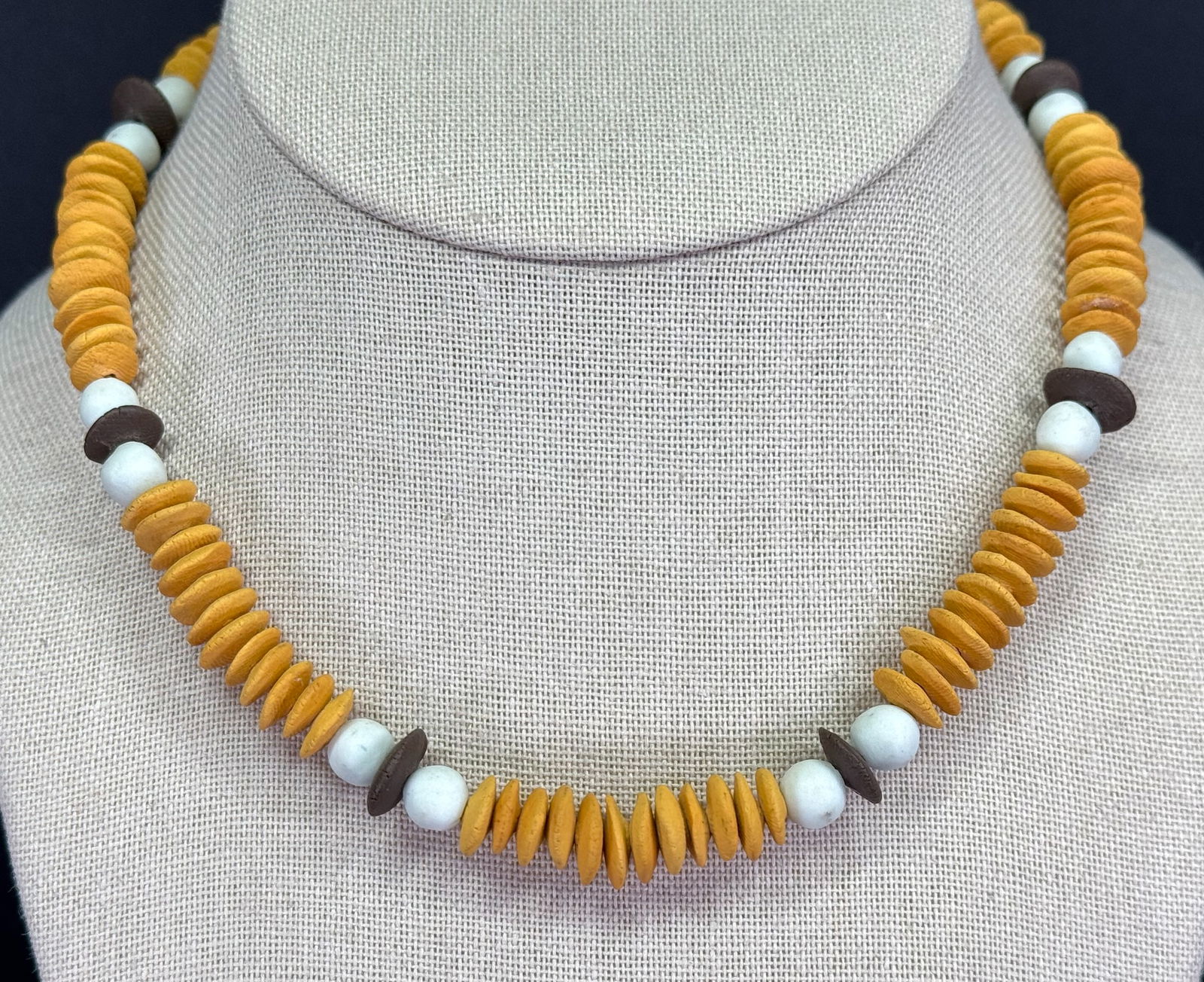 Vintage ethnic clay beaded choker necklace: Vintage ethnic clay beaded choker necklace. Unmarked. For measures please refer to the pictures taken with a measuring tape. Weight: 30 Grams. IN HOUSE Estimated* shipping and handling cost within the