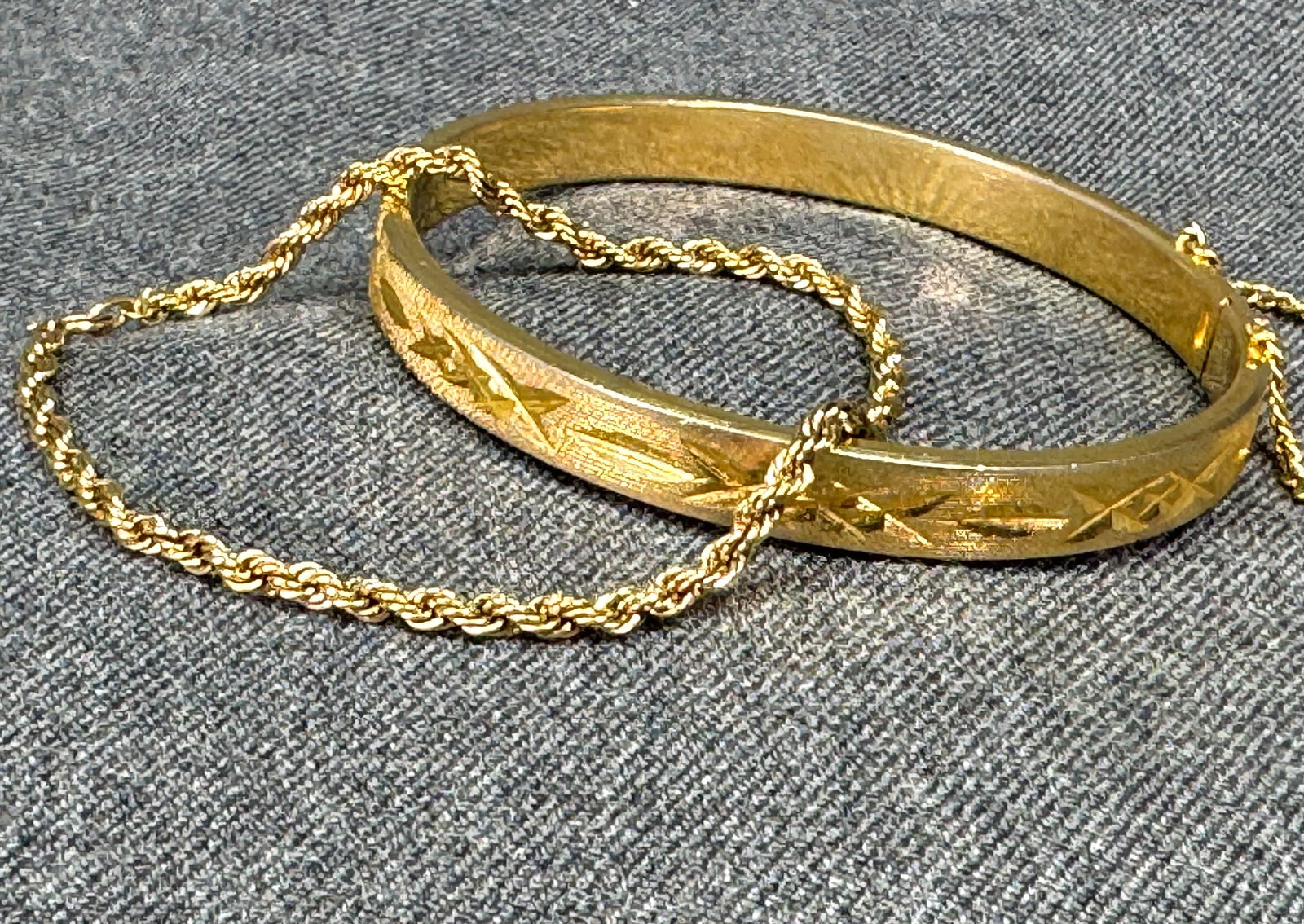 Vintage goldtone diamond cut hinged and 12K gold-filled rope chain bracelets: Vintage goldtone diamond cut hinged and 12K gold-filled rope chain bracelets. The chain is marked 1/20 12K GF, the hinged one is unmarked. For measures please refer to the pictures taken with a measur