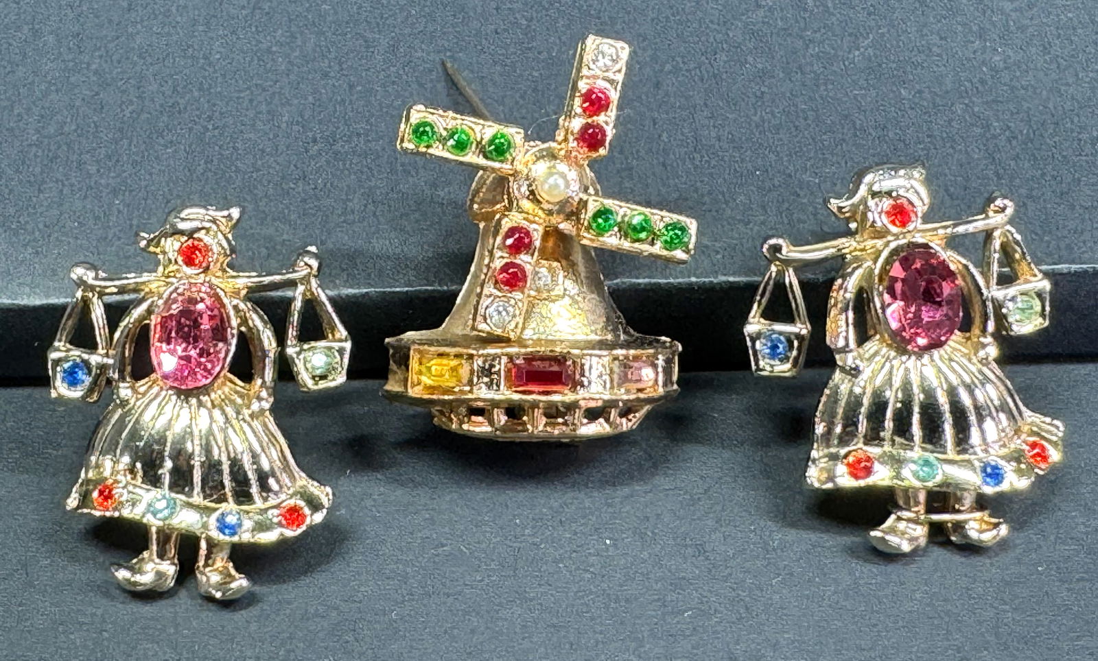 Vintage color rhinestones goldtone metal Dutch dolls & working blades windmill pin brooches. (1 of 8)