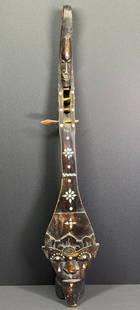 Lombok Island Indonesia Lute. Carved wood with mother of pearl inlaid: Lombok Island Indonesia Lute. Carved wood with mother of pearl inlaid. It measures 25 1/2 inches long and 5 inches widest. IN HOUSE Estimated* shipping and handling cost within the U.S. : $ 29 We comb