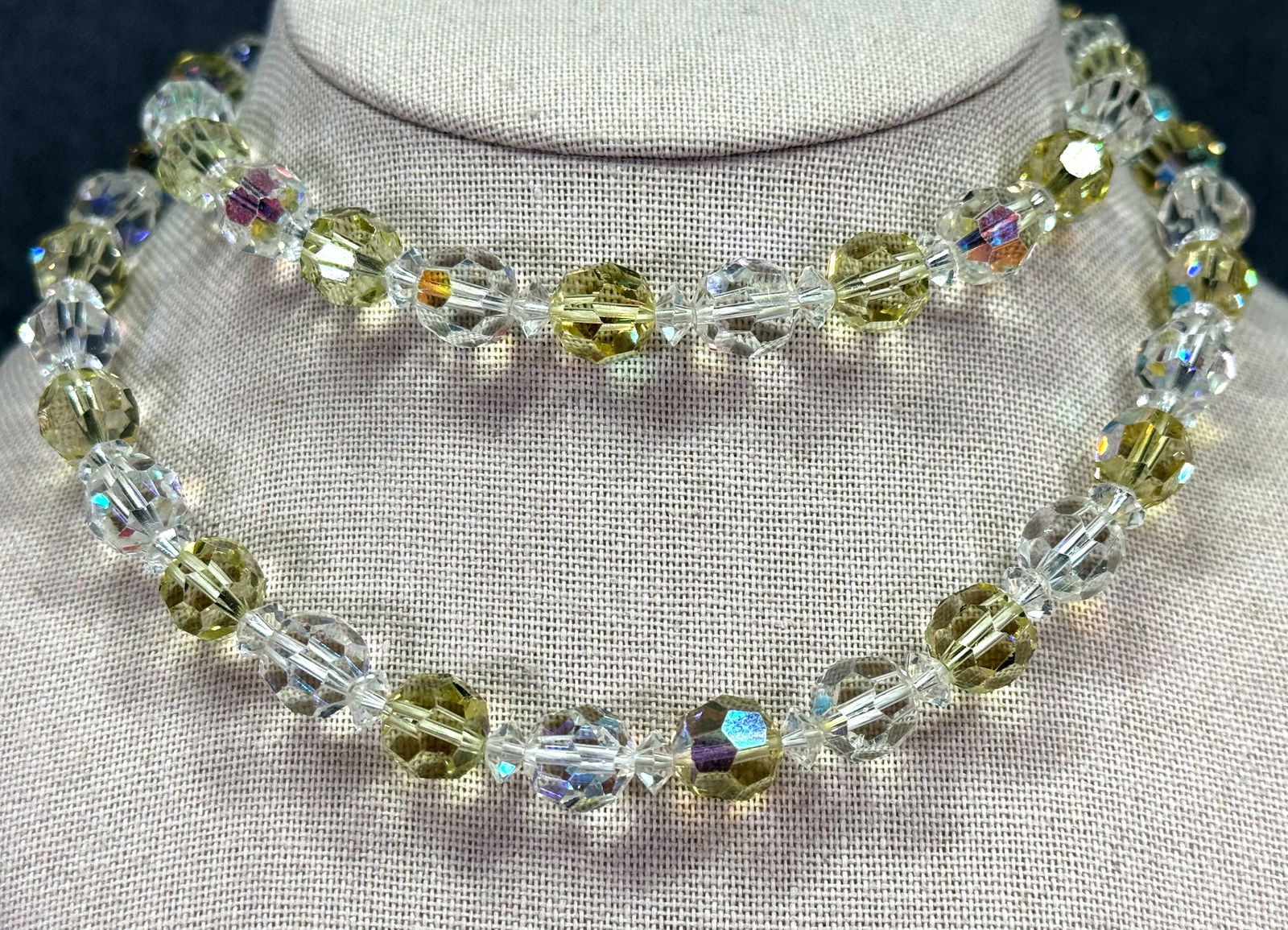 Vintage clear and AB yellowish faceted clear beads necklace: Vintage clear and AB yellowish faceted clear beads necklace. Unmarked. For measures please refer to the pictures taken with a measuring tape. Weight: 77 Grams IN HOUSE Estimated* SHIPPING & HANDLING C