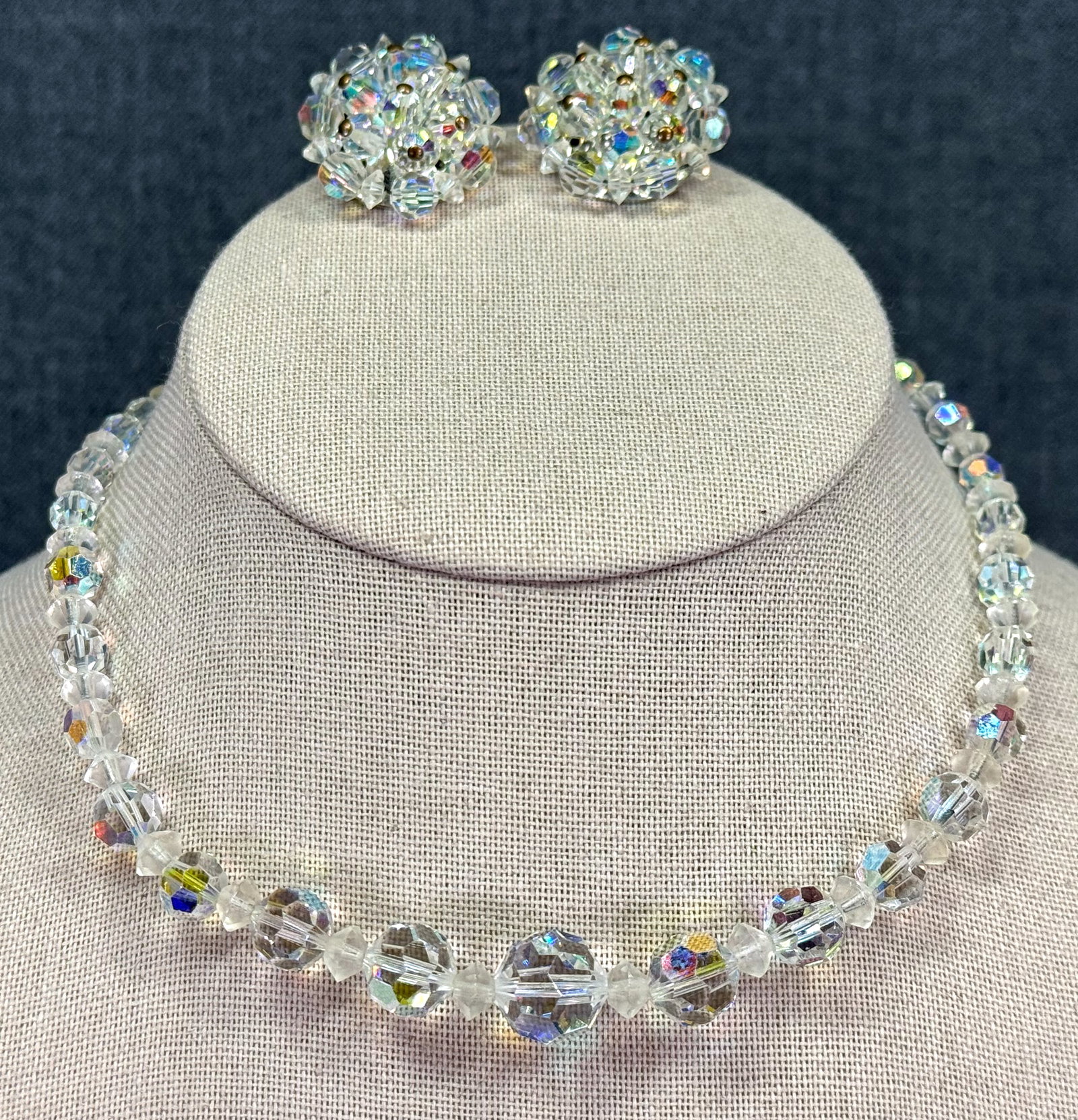 Vintage AB clear faceted graduated beads choker necklace & clip earrings: Vintage AB clear faceted graduated beads choker necklace & clip earrings. Unmarked. For measures please refer to the pictures taken with a measuring tape. Weight: 42 Grams IN HOUSE Estimated* SHIPPING