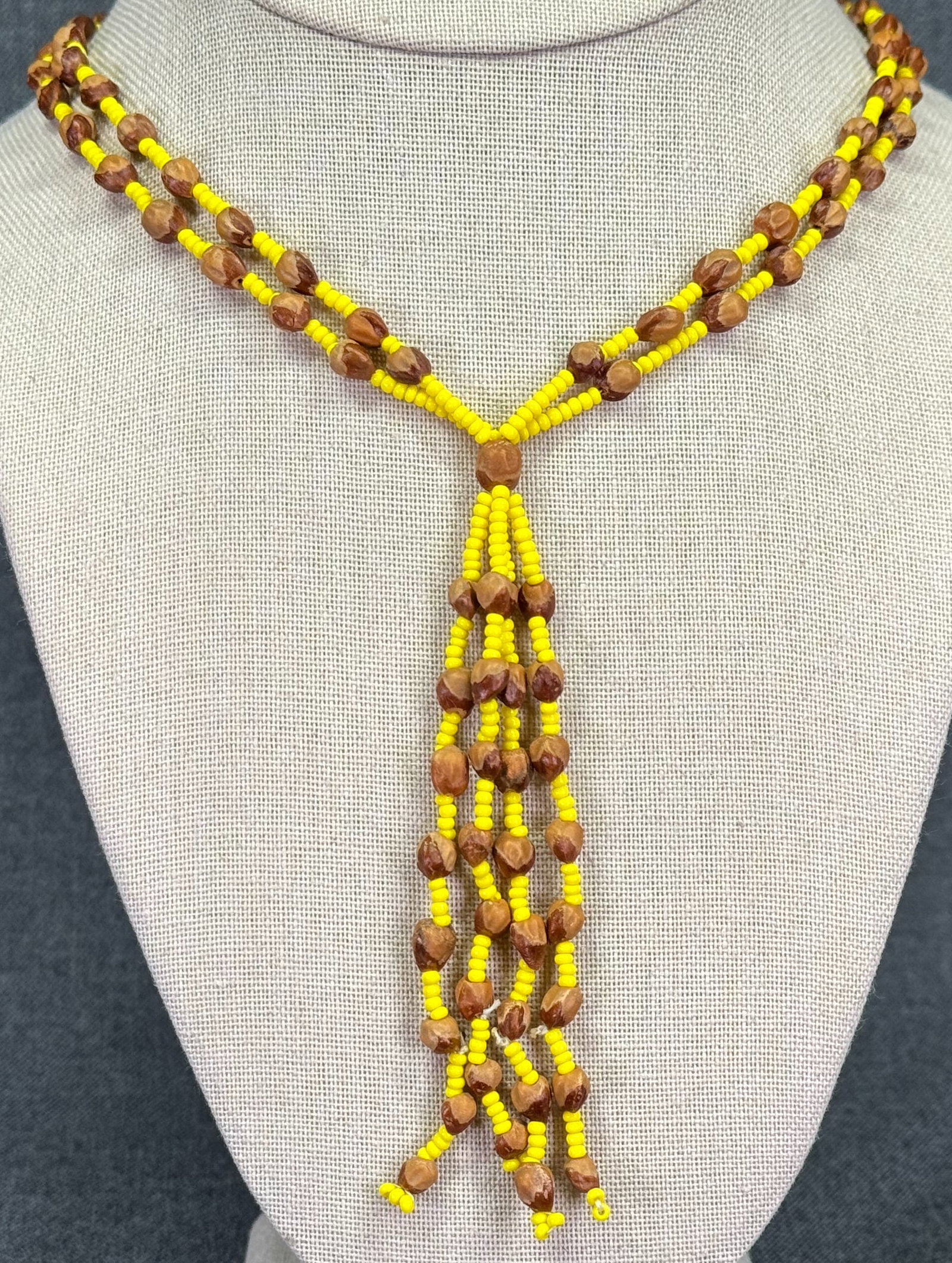 Navajo Ghost Spirit Cedar Juniper Berry Seeds and Yellow Glass Beaded Necklace: Navajo Ghost Spirit Cedar Juniper Berry Seeds and Yellow Glass Beaded Necklace. Unmarked. For measures please refer to the pictures taken with a measuring tape. Weight: 19 Grams IN HOUSE Estimated* SH