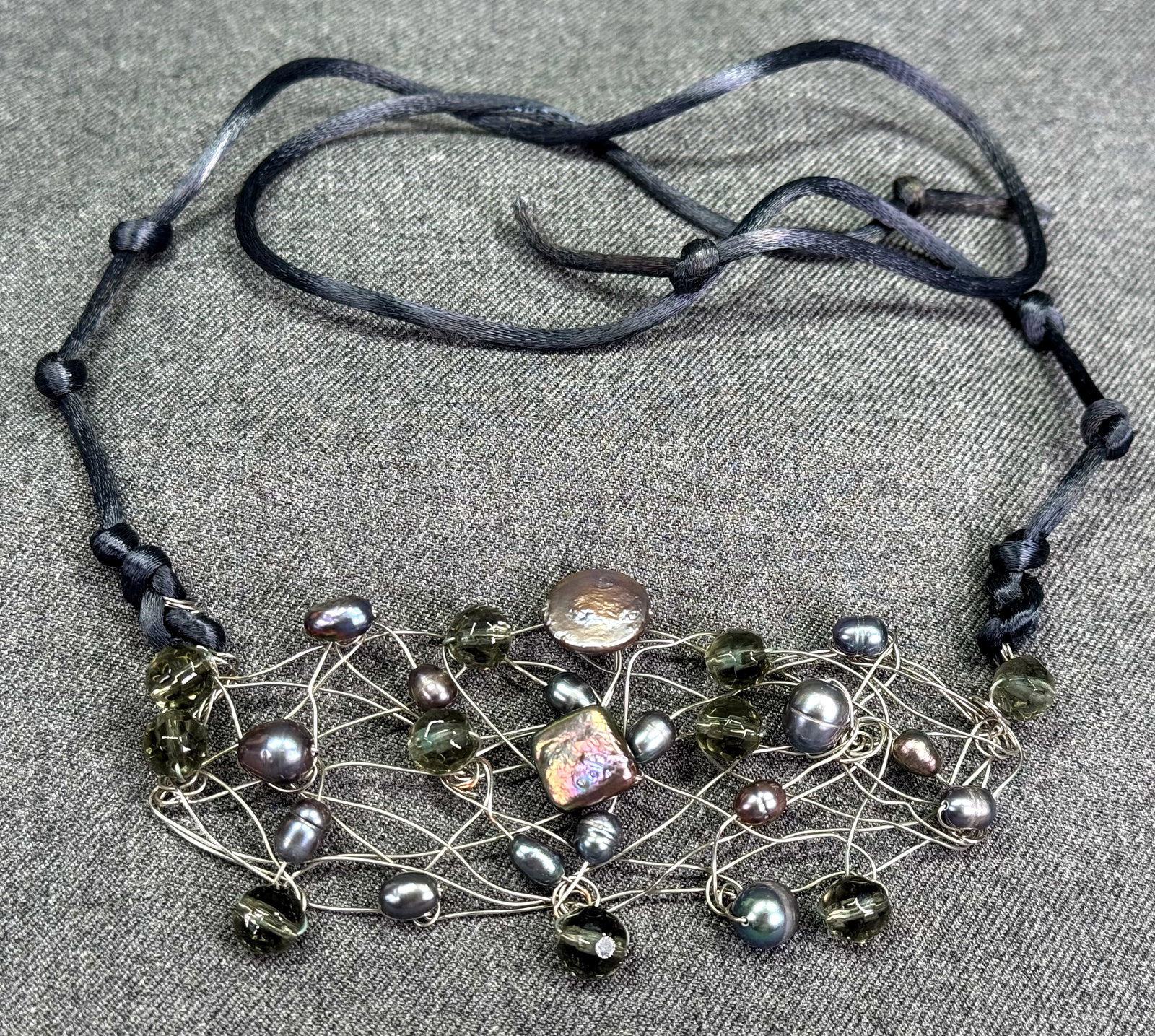 Artsy hand silver wired grayish baroque pearls medallion choker necklace: Artsy hand silver wired grayish baroque pearls medallion choker necklace. Silky straps. Unmarked. For measures please refer to the pictures taken with a measuring tape. Weight: 22 Grams. IN HOUSE Esti