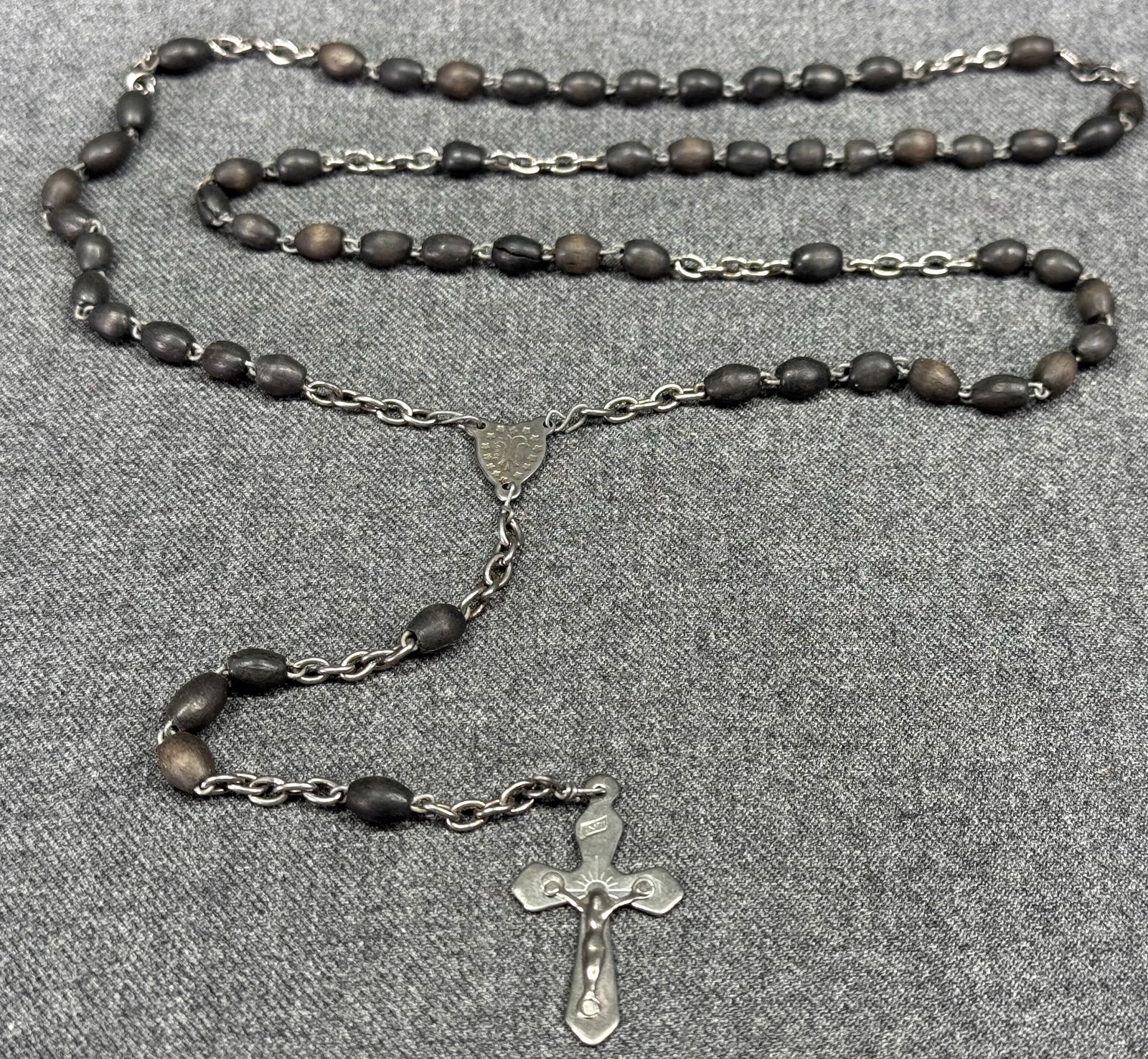 Antique French Queen of Heaven ebony rosary: Antique French Queen of Heaven ebony rosary. Marked France on medal and crucifix. For measures please refer to the pictures taken with a measuring tape. Weight: 15 Grams. IN HOUSE Estimated* shipping