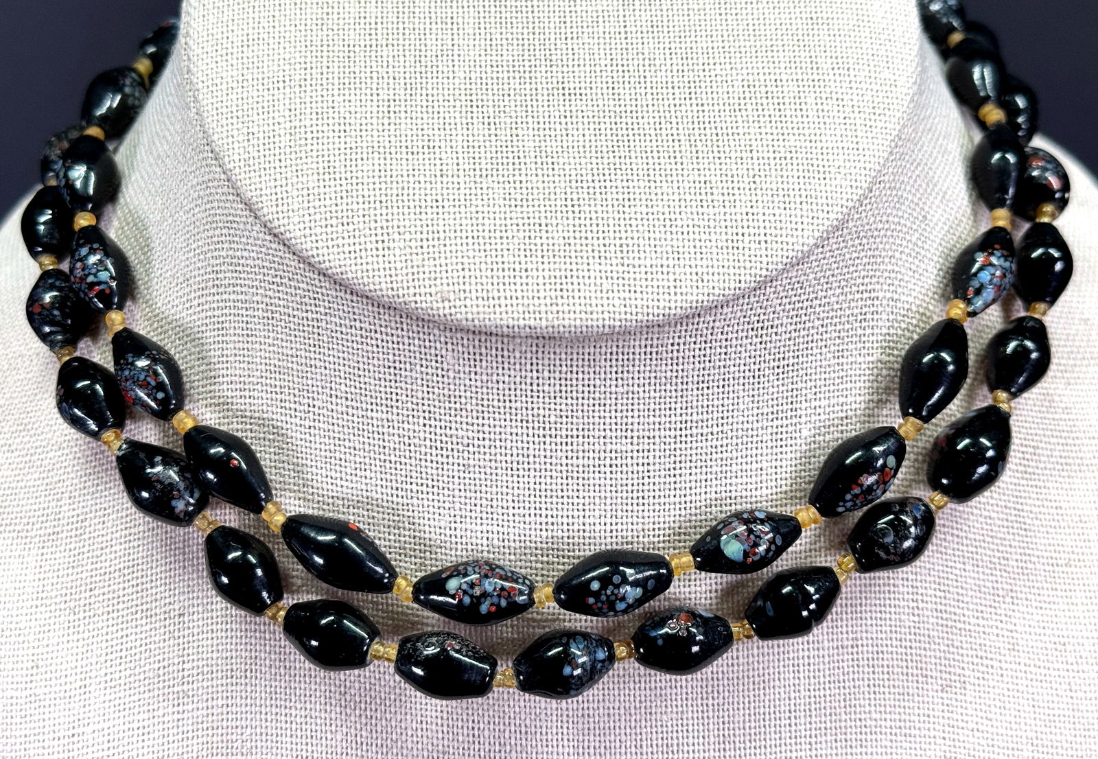 Vintage boho color spots black glass beaded necklaces. Lot of 2: Vintage boho color spots black glass beaded necklaces. Lot of 2. Unmarked. For measures please refer to the pictures taken with a measuring tape. Weight: 80 Grams. This is a NO RESERVE AUCTION: there