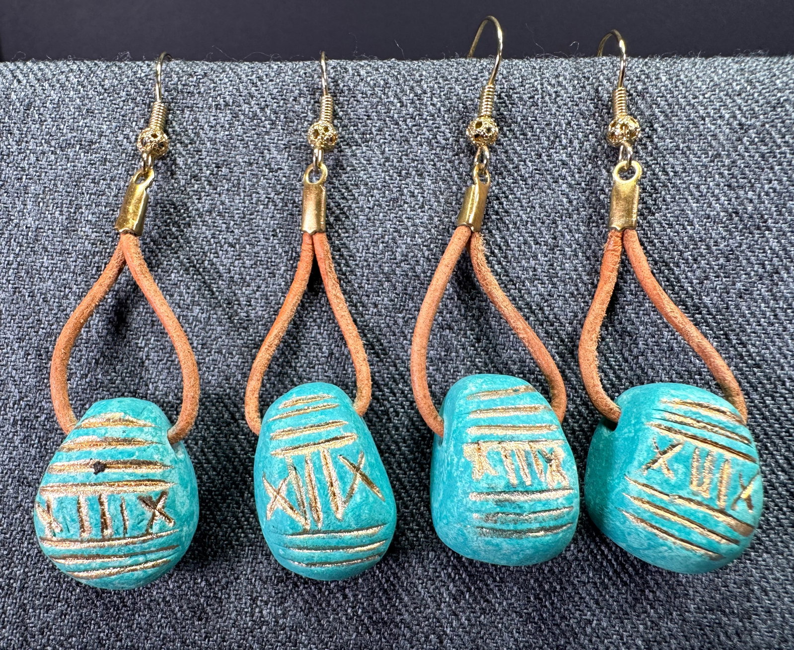 Vintage ethnic style golden accents aqua pottery hook earrings. Unused. Lot of 2: Vintage ethnic style golden accents coral color pottery hook earrings. Genuine leather straps. Unused. Lot of 2. Unmarked. For measures please refer to the pictures taken with a measuring tape. Weight