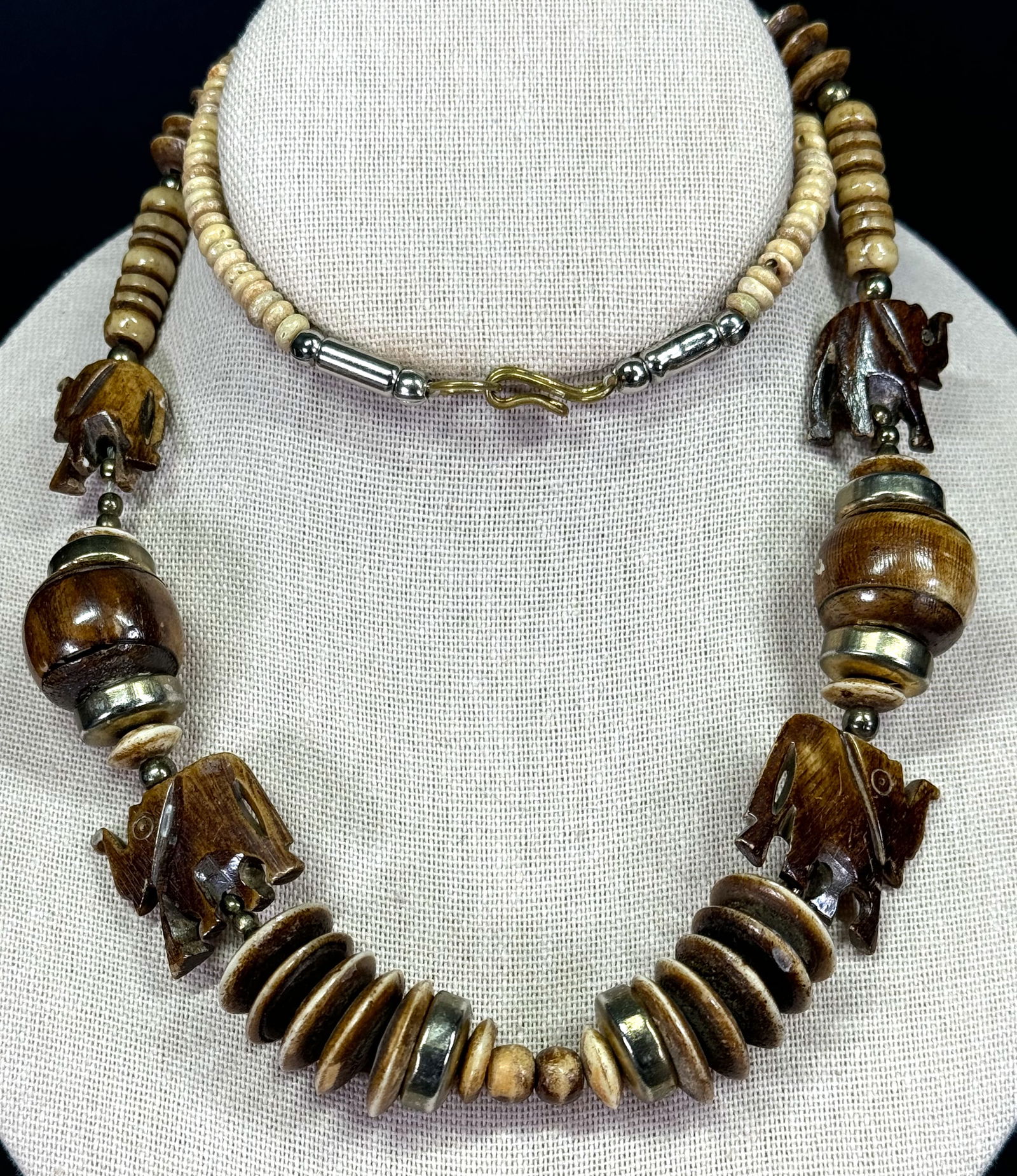 Vintage carved bone elephant dangle and beads, trade bead and assorted glass beads necklace.: Vintage carved and dyed bone & metal elephants and assorted necklace. Silvertone metal clasp. Unmarked. For measures please refer to the pictures taken with a measuringtape. Weight: 64 Grams. This is
