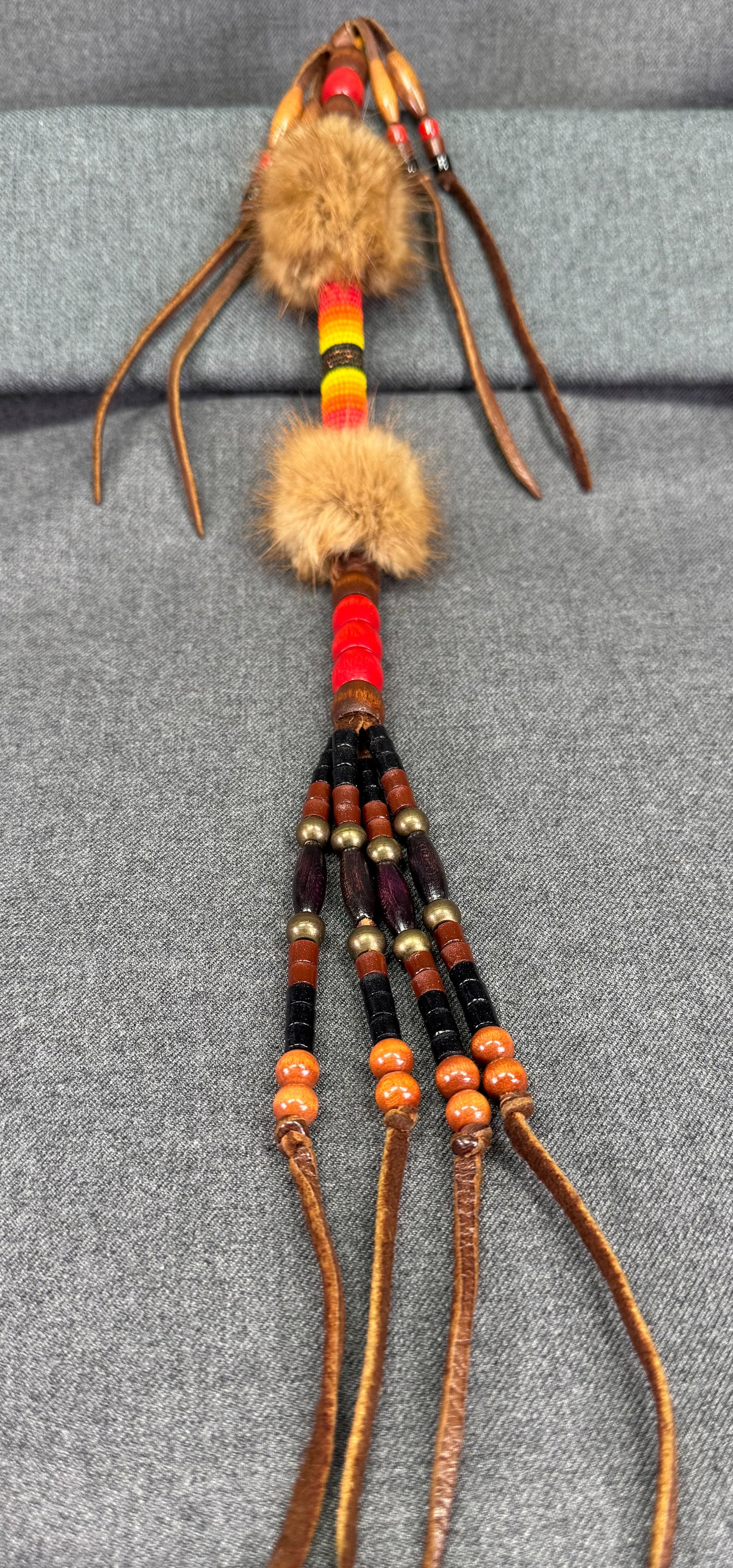 Vintage native American style glass beaded, fur, wood, metal & leather tassel pendant: Vintage native American style glass beaded, fur, wood, metal & leather tassel pendant . Unmarked . For measures please refer to the pictures taken with a measuring tape. Weight: 38 Grams. IN HOUSE Est