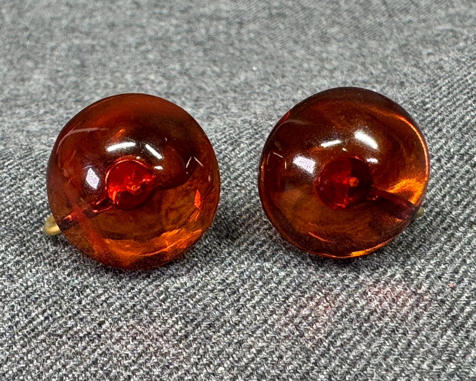 Vintage MCM dome amber bead 12K gold-filled screw back earrings: Vintage MCM dome amber bead 12K gold-filled screw back earrings. Marked 1/20 12K GF. For measures please refer to the pictures taken with a measuring tape. Weight: 3.73 Grams. IN HOUSE Estimated* SHIP