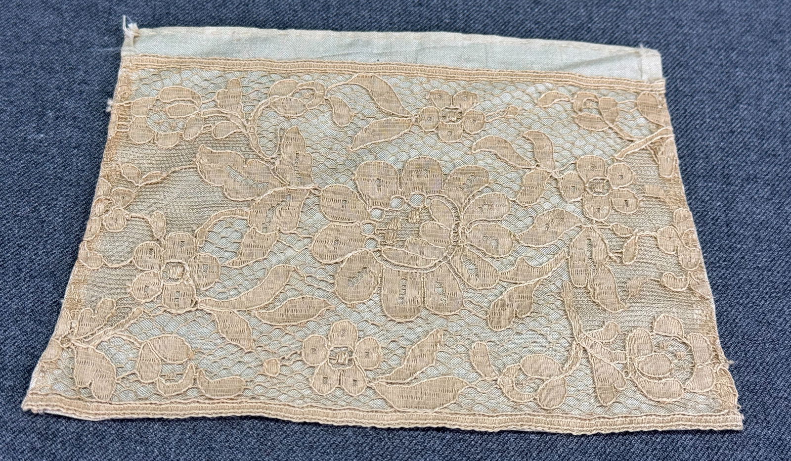 Vintage flowers lace piece lined in fabric: Vintage flowers lace piece lined in fabric. For measures please refer to the pictures taken with a measuring tape. IN HOUSE Estimated* shipping and handling cost within the U.S. : $7 We combine shippi