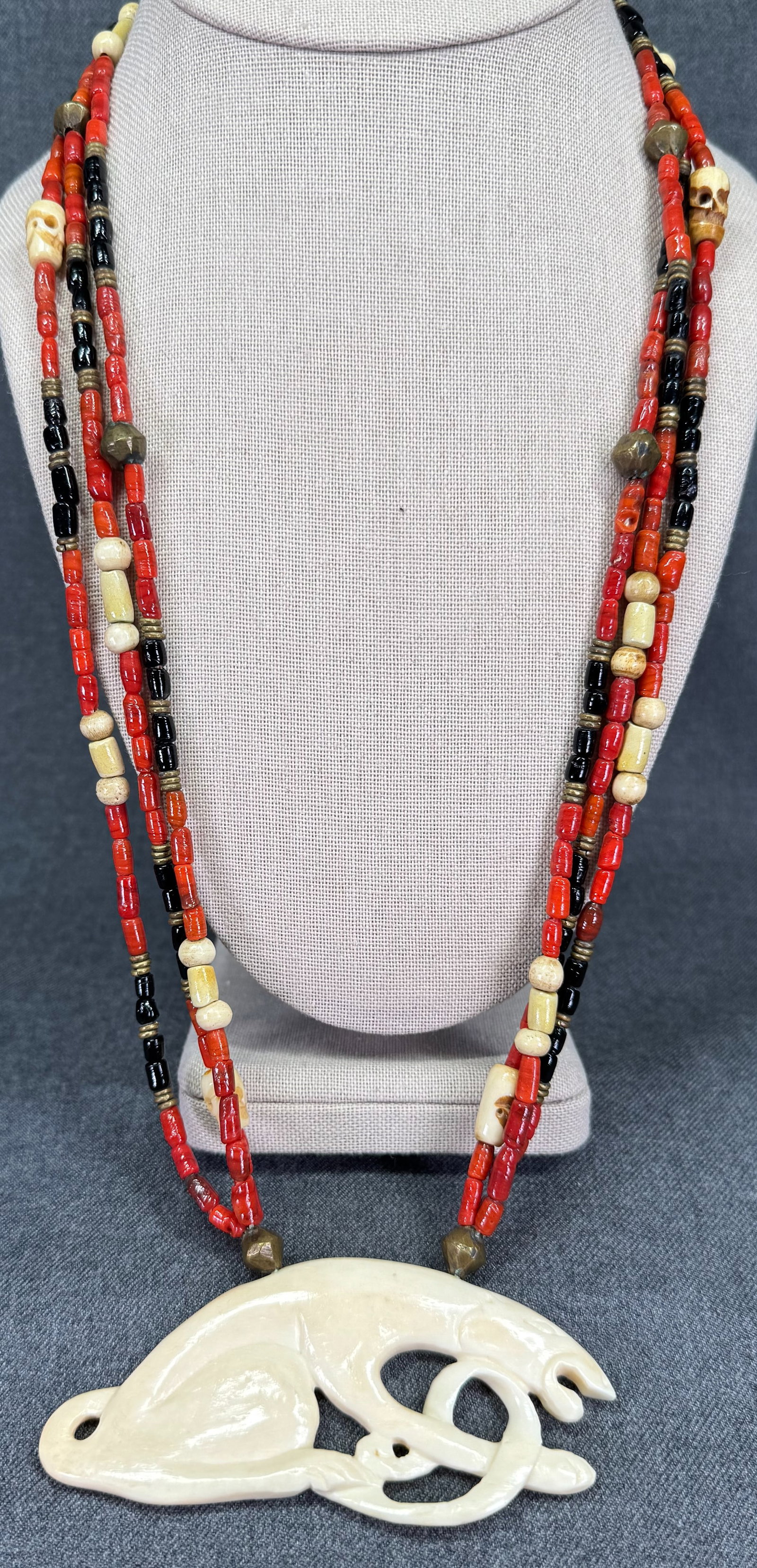 Vintage ethnic style panther medallion bone, glass, metal beads necklace: Vintage ethnic style panther medallion bone, glass, metal beads 3 strands necklace. For measures please refer to the pictures taken with a measuring tape. Weight: 80 Grams. IN HOUSE Estimated* SHIPPIN
