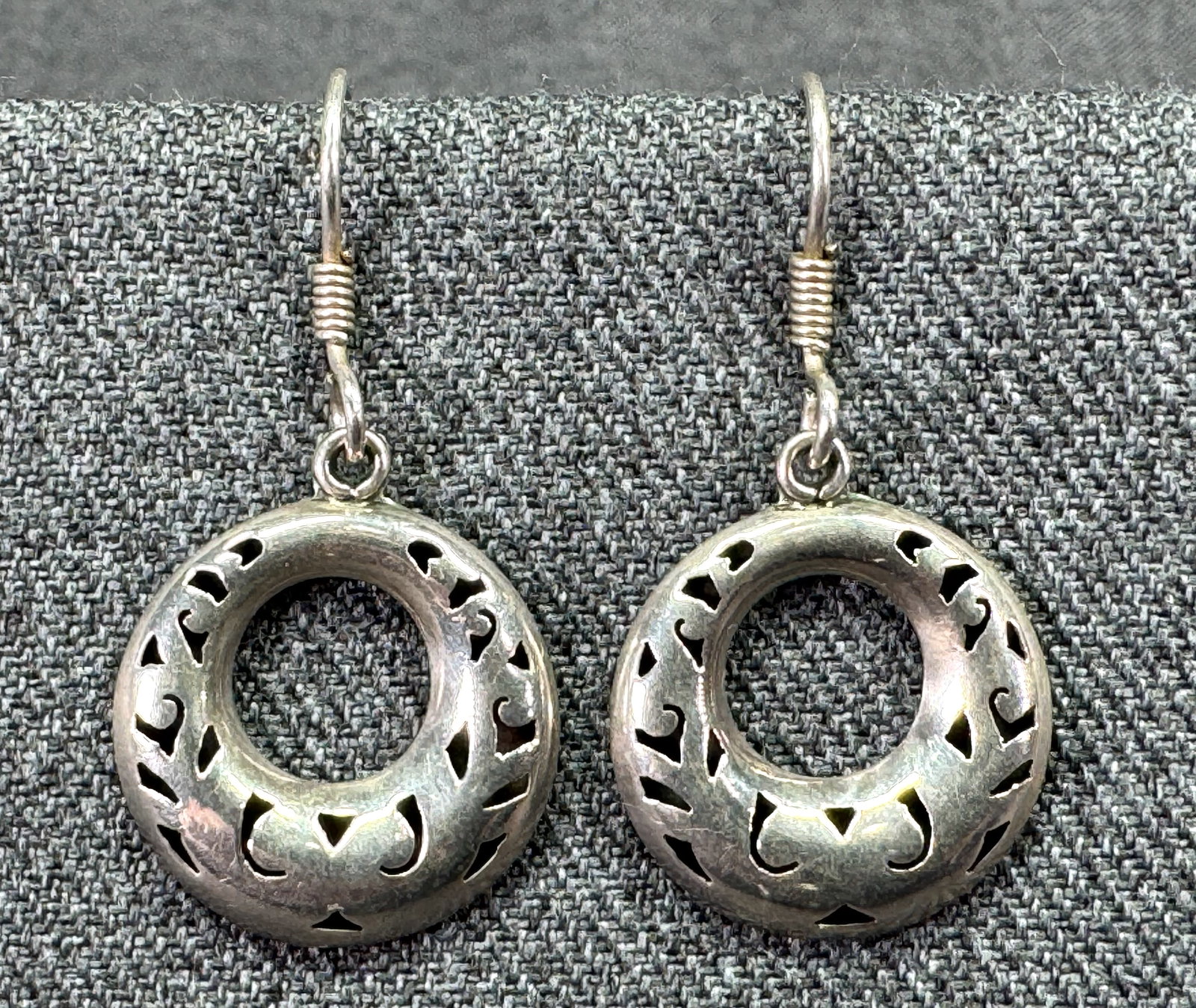 Vintage Mexican TA-34 cut out puffy hoop sterling silver hook earrings: Vintage Mexican TA-34 cut out puffy hoop sterling silver hook earrings. Marked Mexico TA-34 925. For measures please refer to the pictures taken with a measuring tape. Weight: 2.77 Grams. IN HOUSE Est