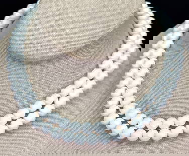 Vintage faceted milky white glass beads 2 strands necklace: Vintage faceted milky white glass beads 2 strands necklace. Unmarked. Goldtone metal clasp. For measures please refer to the pictures taken with a measuring tape. Weight: 95 Grams. This is a NO RESERV