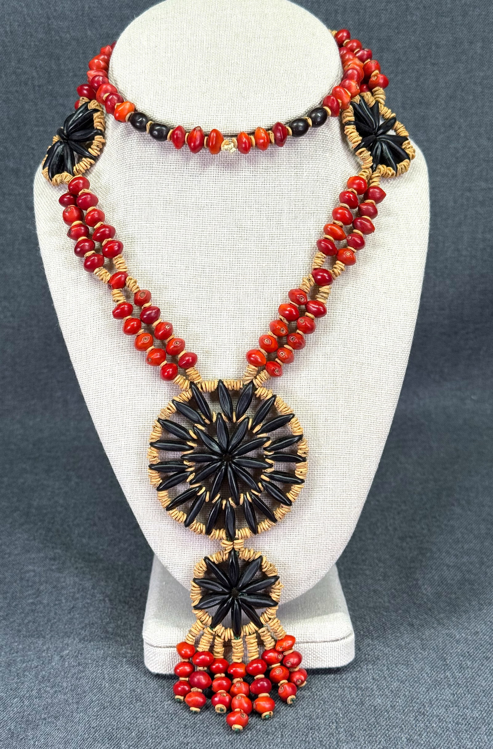 Vintage ethnic Caribbean / South American flowers medallions seeds necklace: Vintage ethnic Caribbean / South American flowers medallions seeds necklace. Unmarked. For measures please refer to the pictures taken with a measuring tape. Weight: 47 Grams. IN HOUSE Estimated* SHIP