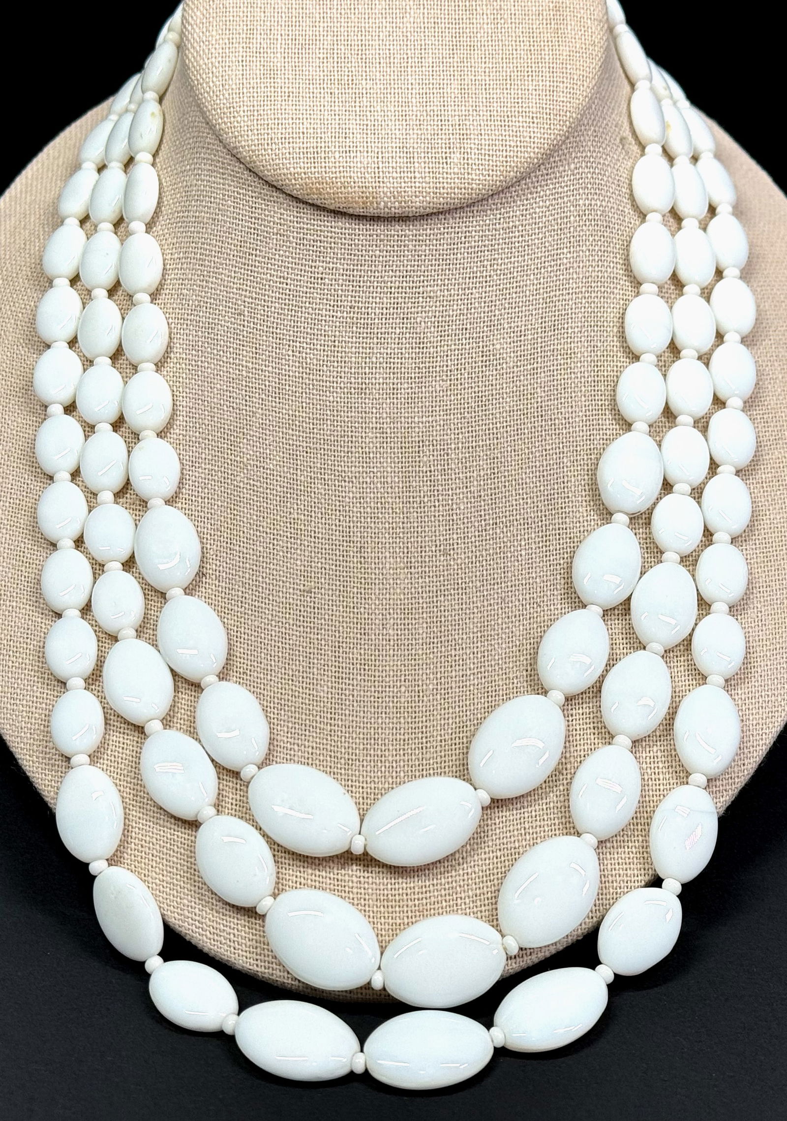 Vintage milky white glass beads 3 strands collar necklace.: Vintage milky white glass beads 3 strands collar necklace. Unmarked. Goldtone metal clasp. For measures please refer to the pictures taken with a measuring tape. Weight: 100 Grams. This is a NO RESERV