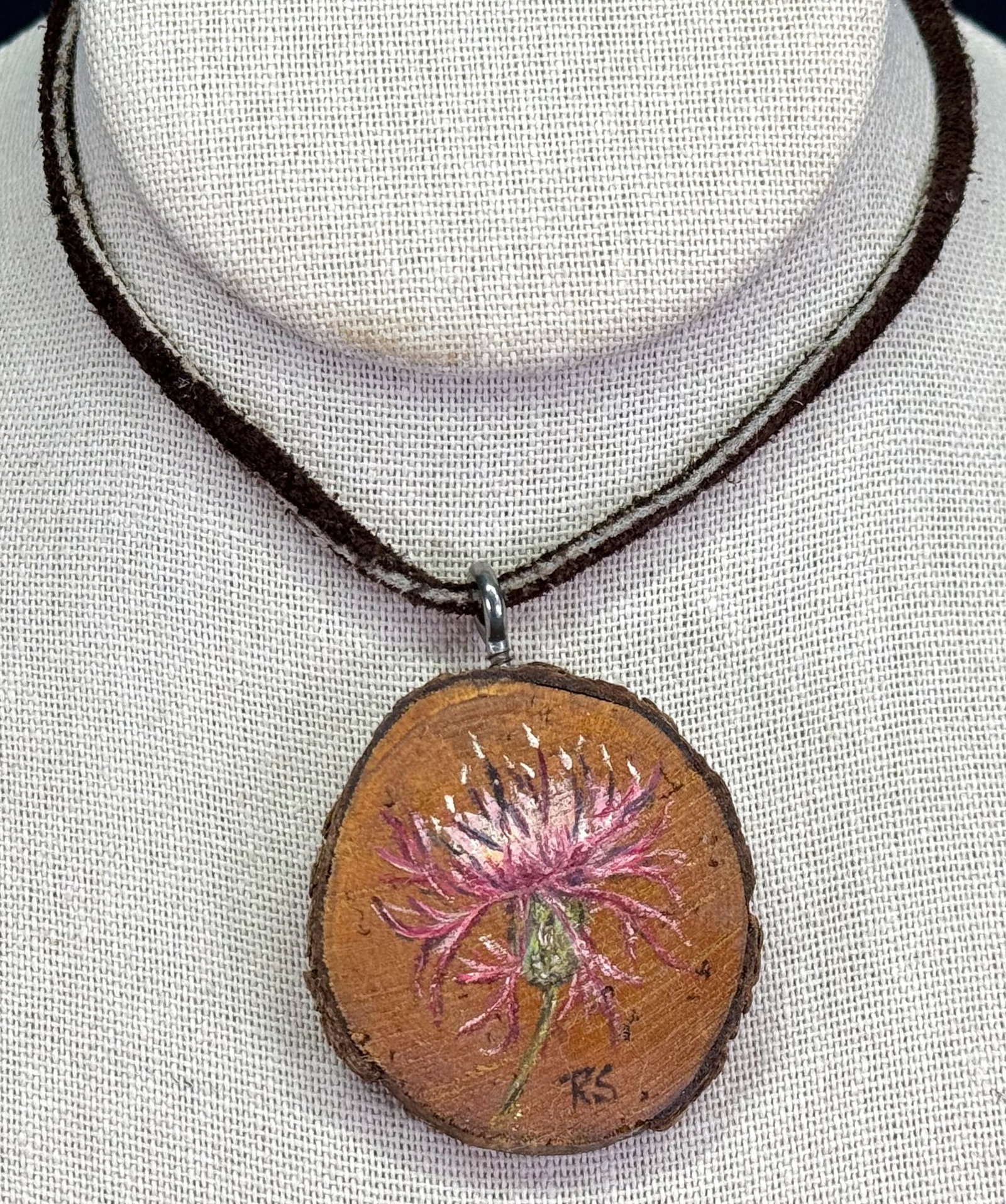 Vintage artsy hand painted knapweed flower wooden slice pendant leather strap necklace.: Vintage artsy hand painted knapweed flower wooden slice pendant leather strap necklace. Signed RS. For measures please refer to the pictures taken with a measuring tape. Weight: 11 Grams. This is a NO