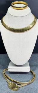 Vintage 80s Monet goldtone omega choker and bracelet & an unbranded extensible belt: Vintage 80s Monet goldtone omega choker and bracelet (both marked) & an unbranded extensible belt (unmarked). For measures please refer to the pictures taken with a measuring tape. Weight: 110 Grams.