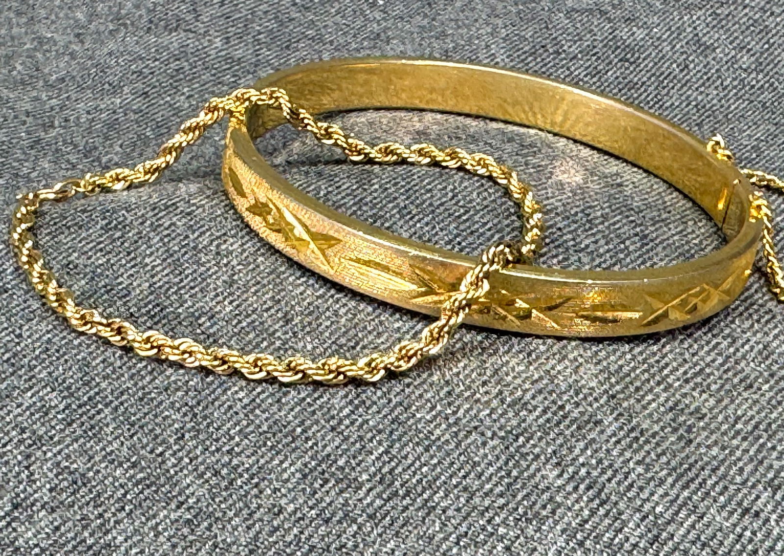Vintage goldtone diamond cut hinged and 12K gold-filled rope chain bracelets: Vintage goldtone diamond cut hinged and 12K gold-filled rope chain bracelets. The chain is marked 1/20 12K GF, the hinged one is unmarked. For measures please refer to the pictures taken with a measur