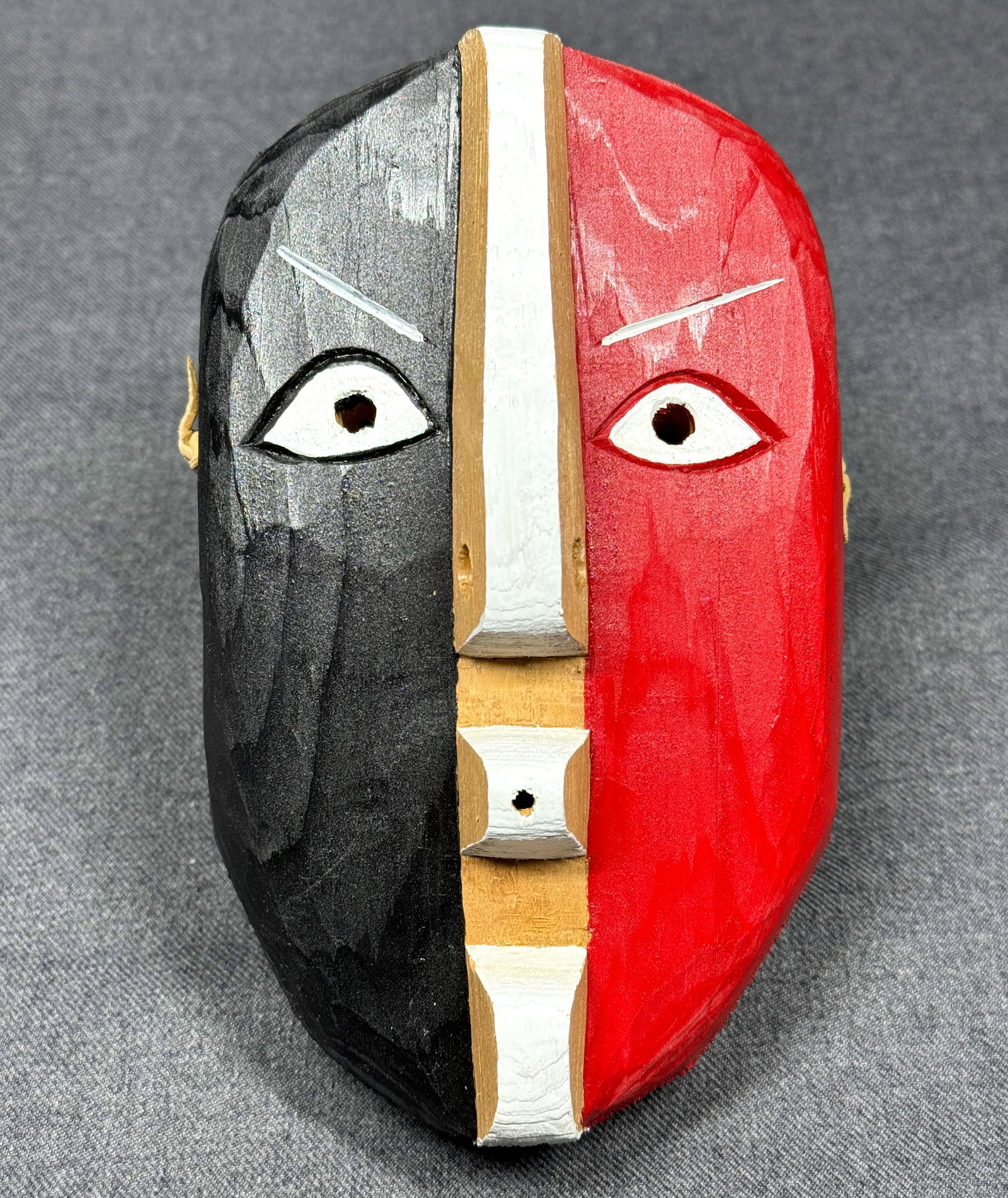 Vintage David Migwans Manitoulin Island “Half and Half?? Mask: Vintage David Migwans Manitoulin Island “Half and Half” Mask Carved and painted cedar wood, leather. Signed on the back. Paper label from the Ojibwe Cultural Foundation with information. For m