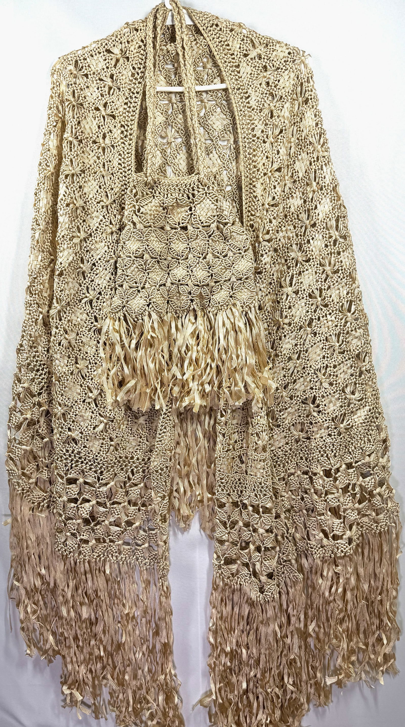 Antique 1920s ecru ribbon hand knotted macrame wrap piano shawl & purse: Antique 1920s ecru ribbon hand knotted macrame wrap piano shawl & purse The shawl measures 96 x 34 inches fringe included. The purse measures 24 inches long hanged and 10 inches widest on bottom. Weig