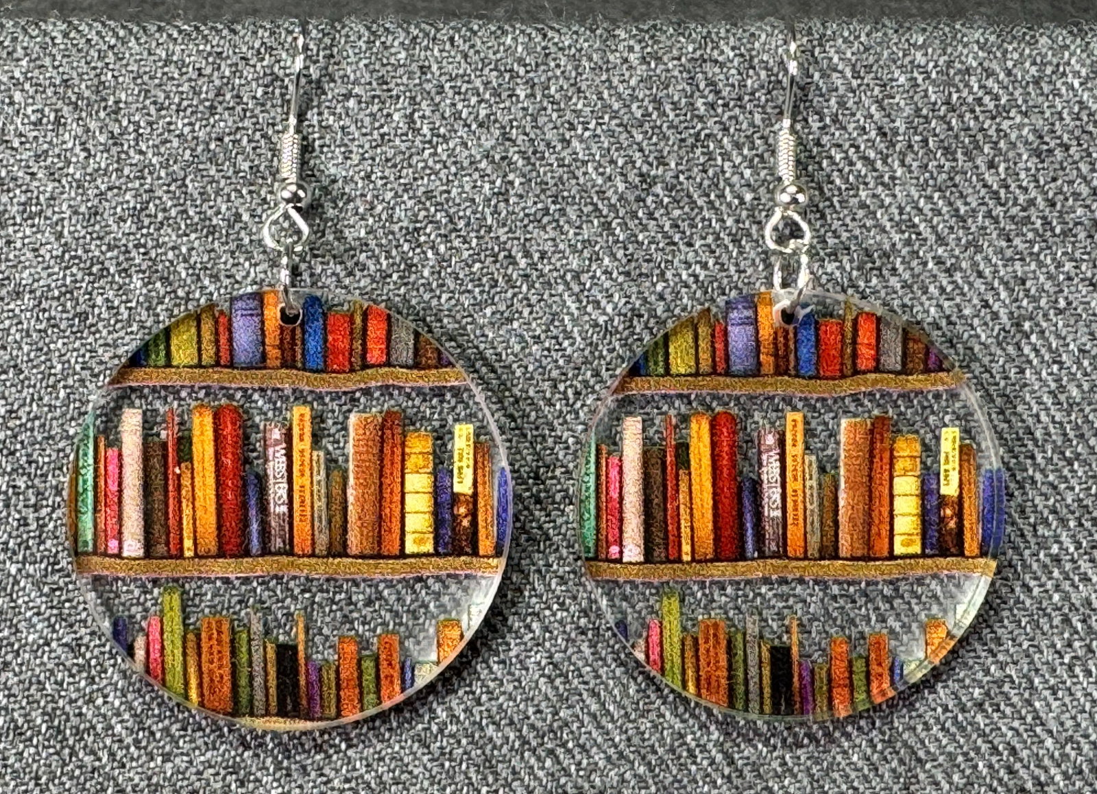 Color books clear plastic dangle hook earrings: Color books clear plastic dangle hook earrings. Unmarked. For measures please refer to the pictures taken with a measuring tape. Weight: 48 Grams. IN HOUSE Estimated* SHIPPING & HANDLING COST WITHIN T