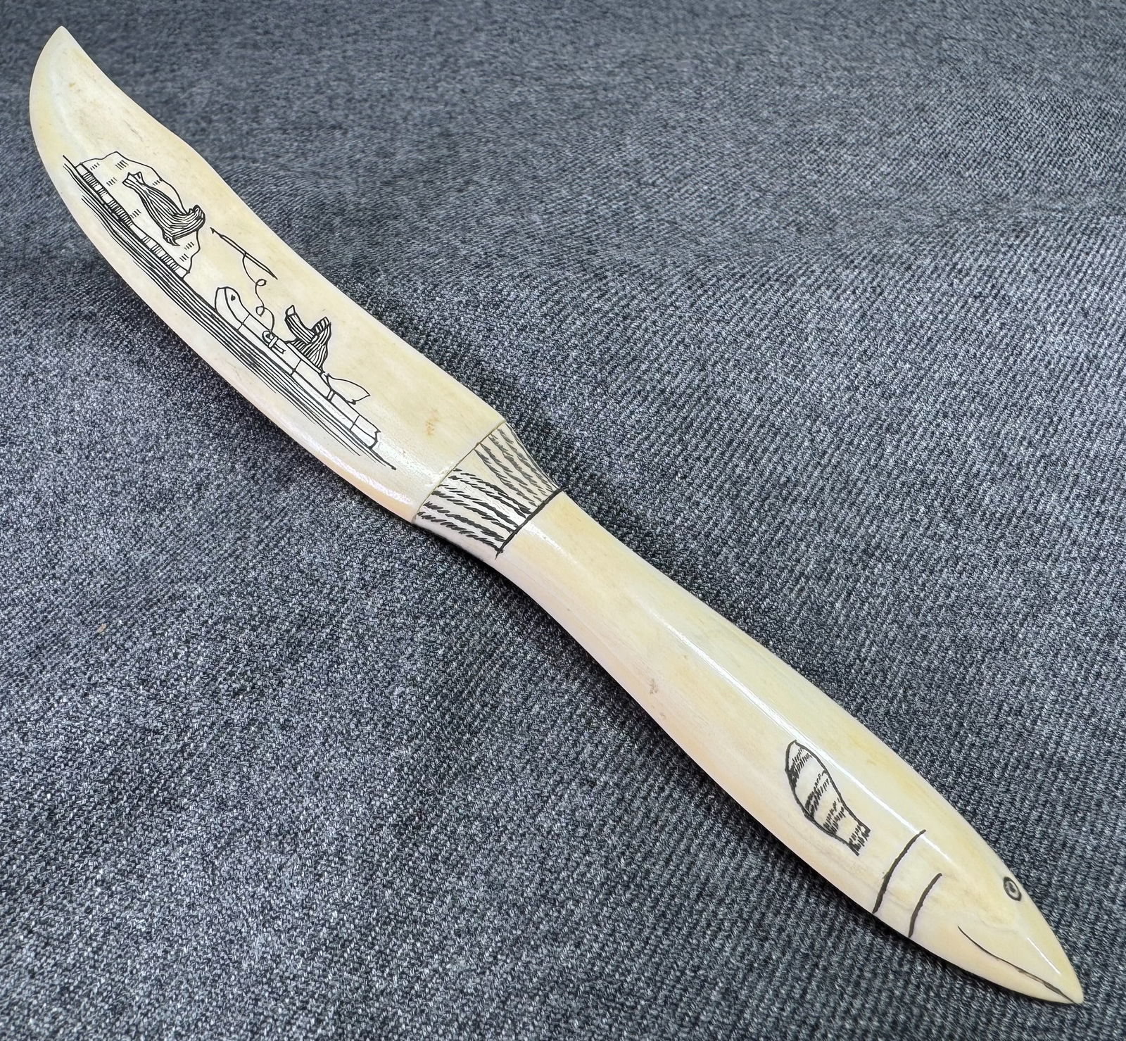 Inuit Scrimshaw Letter Opener. Decorated with a hunting scene.: Inuit Scrimshaw Letter Opener. Decorated with a hunting scene.. For measures please refer to the pictures taken with a measuring tape. IN HOUSE Estimated* SHIPPING & HANDLING COST WITHIN THE U.S. : $7