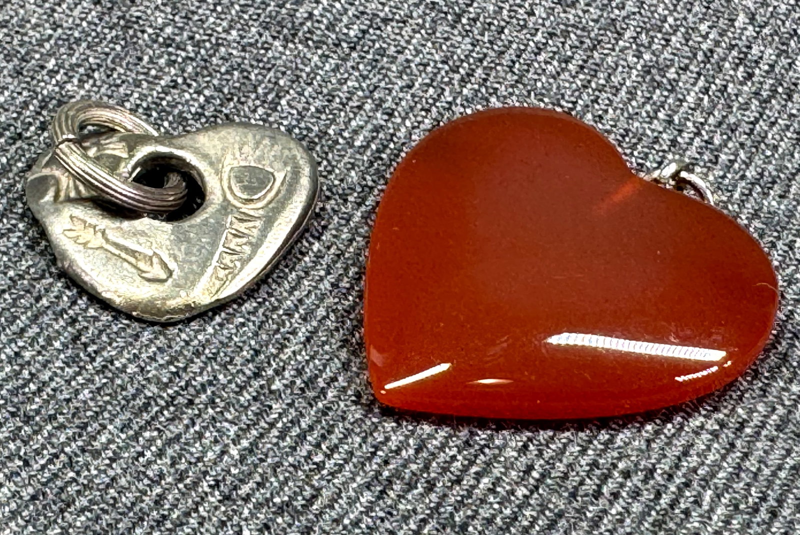 Vintage carnelian stone & stamped Native American designs silevrtone metal heart pendants: Vintage carnelian stone & stamped Native American designs silevrtone metal heart pendants. Unmarked. For measures please refer to the pictures taken with a measuring tape. Weight: 7 Grams IN HOUSE Est