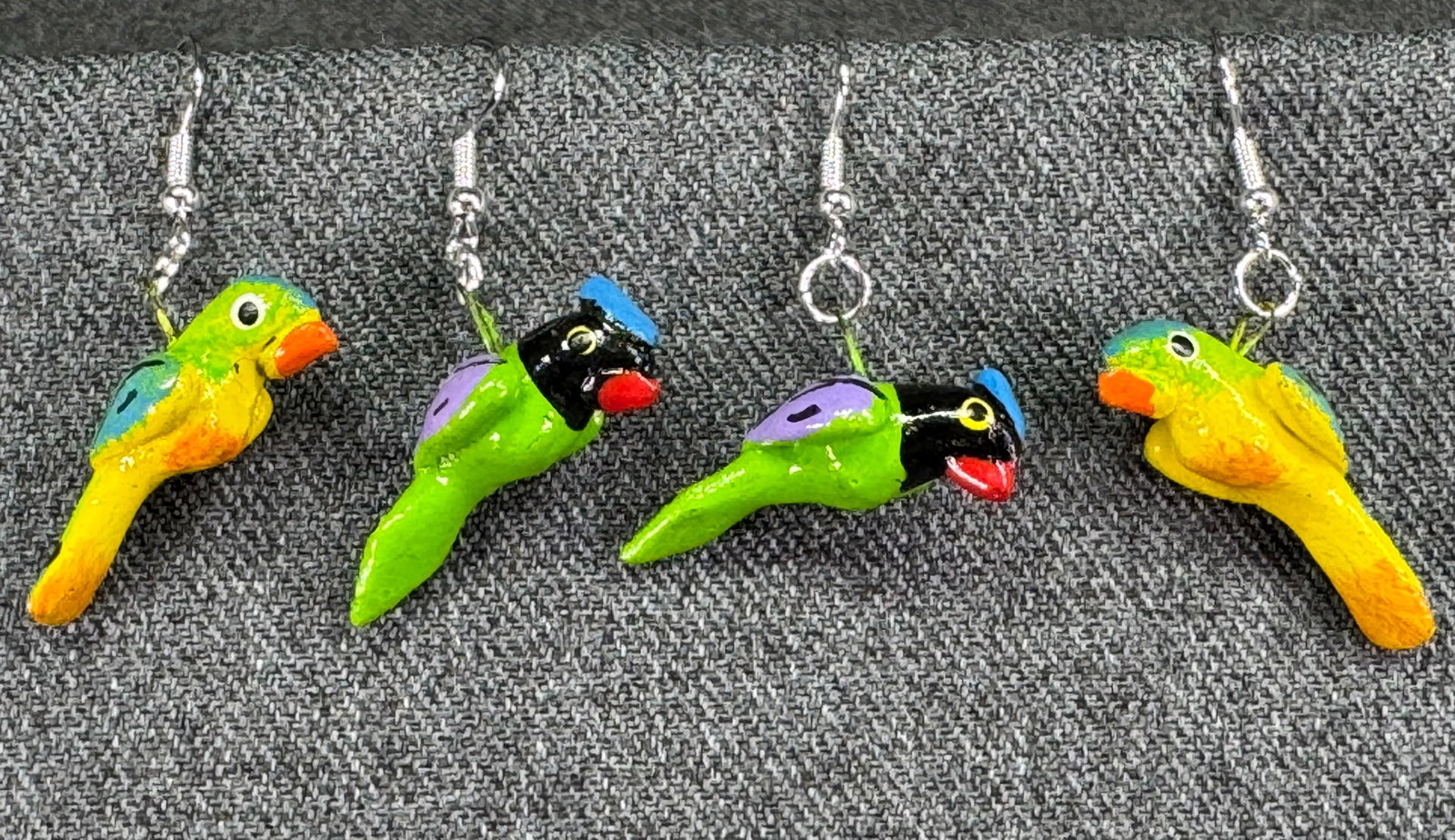 Vintage folk art hand painted wooden peacock and parrot hook earrings: Vintage folk art hand painted wooden peacock and parrot hook earrings. Unmarked. For measures please refer to the pictures taken with a measuring tape. Weight: 9 Grams. IN HOUSE Estimated* shipping an