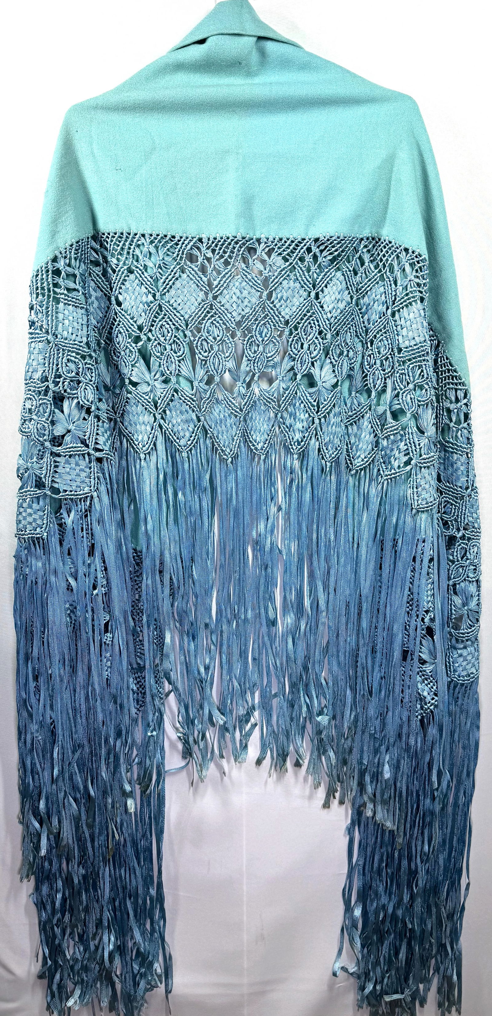 Antique 1920s skyblue fabric with ribbon hand knotted macrame fringe wrap piano shawl: Antique 1920s skyblue fabric with ribbon hand knotted macrame fringe wrap piano shawl. The shawl measures 105 x 39 inches fringe included. The fabric only measures 53 x 13 inches and macrame fringe 26