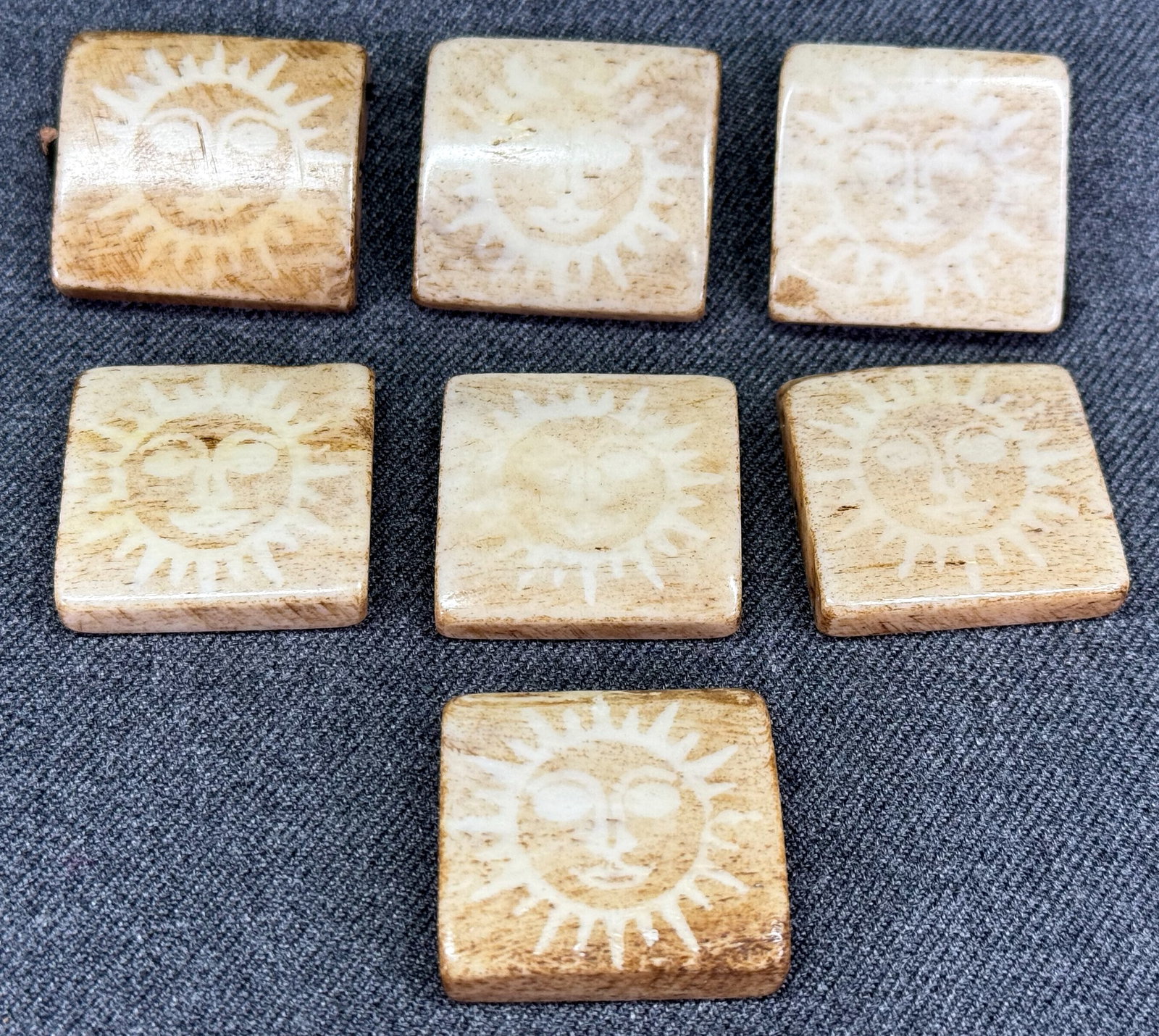 Vintage assorted beige and creamy bone sun face tile beads. Lot of 7: Vintage assorted beige and creamy bone sun face tile beads. Lot of 7. 3 holes on sides. Unmarked. For measures please refer to the pictures taken with a measuring tape. Weight:51Grams. IN HOUSE Estima