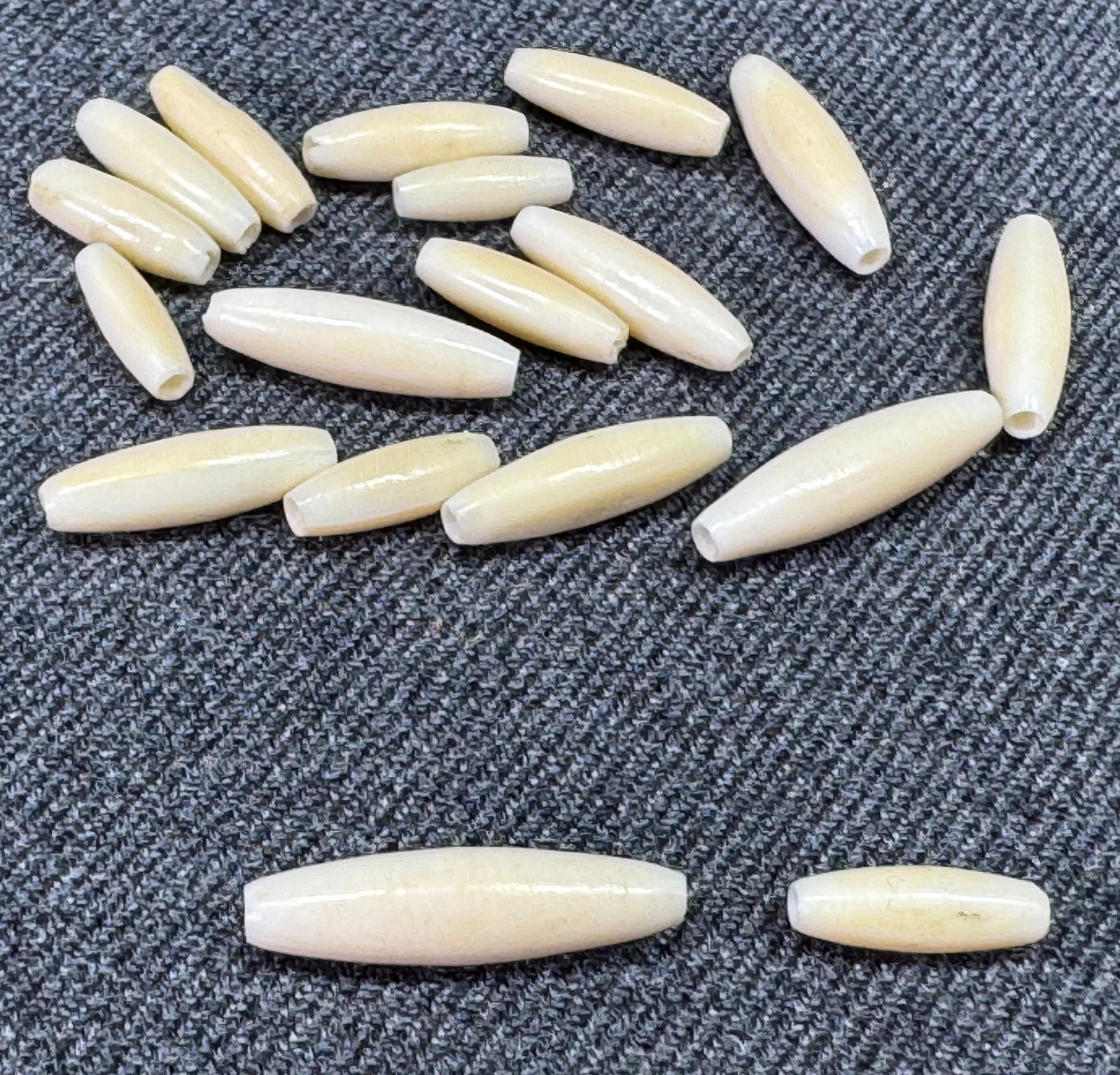 Vintage assorted miniature hair pipe bone beads.: Vintage assorted miniature hair pipe bone beads. Unmarked. For measures please refer to the pictures taken with a measuring tape. Weight: 4 Grams. IN HOUSE Estimated* SHIPPING & HANDLING COST WITHIN T
