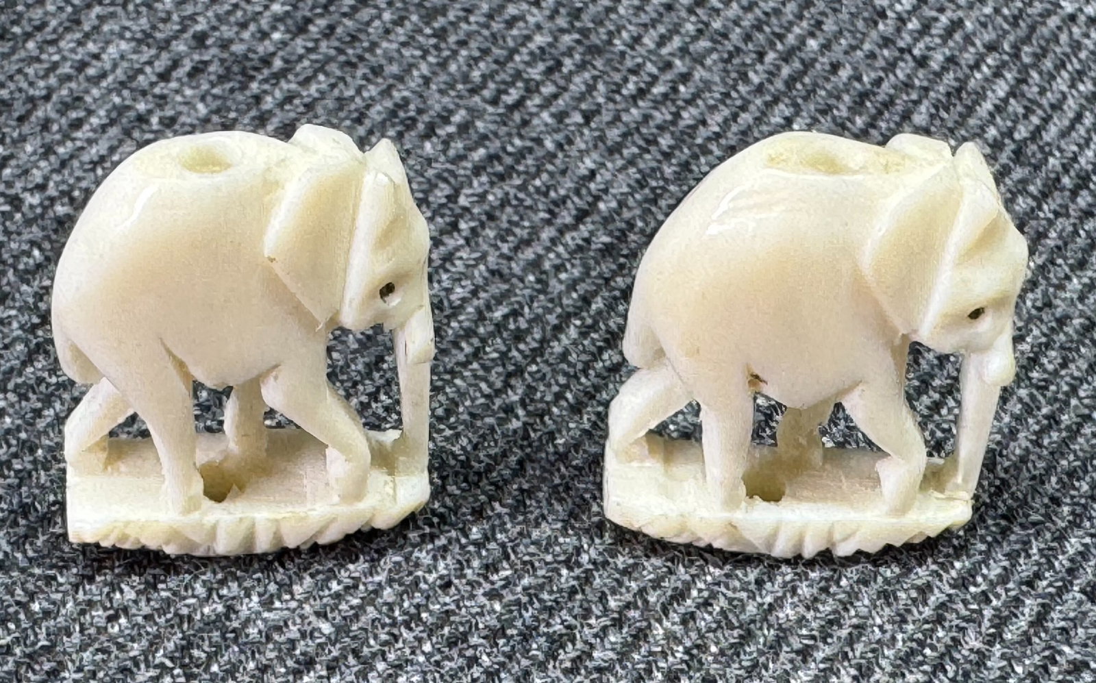 Vintage assorted carved bone elephant beads. Lot of 2: Vintage assorted carved bone elephant beads. Lot of 2. Hole on top and bottom. Unmarked. For measures please refer to the pictures taken with a measuring tape. Weight: 2 Grams. IN HOUSE Estimated* SHI