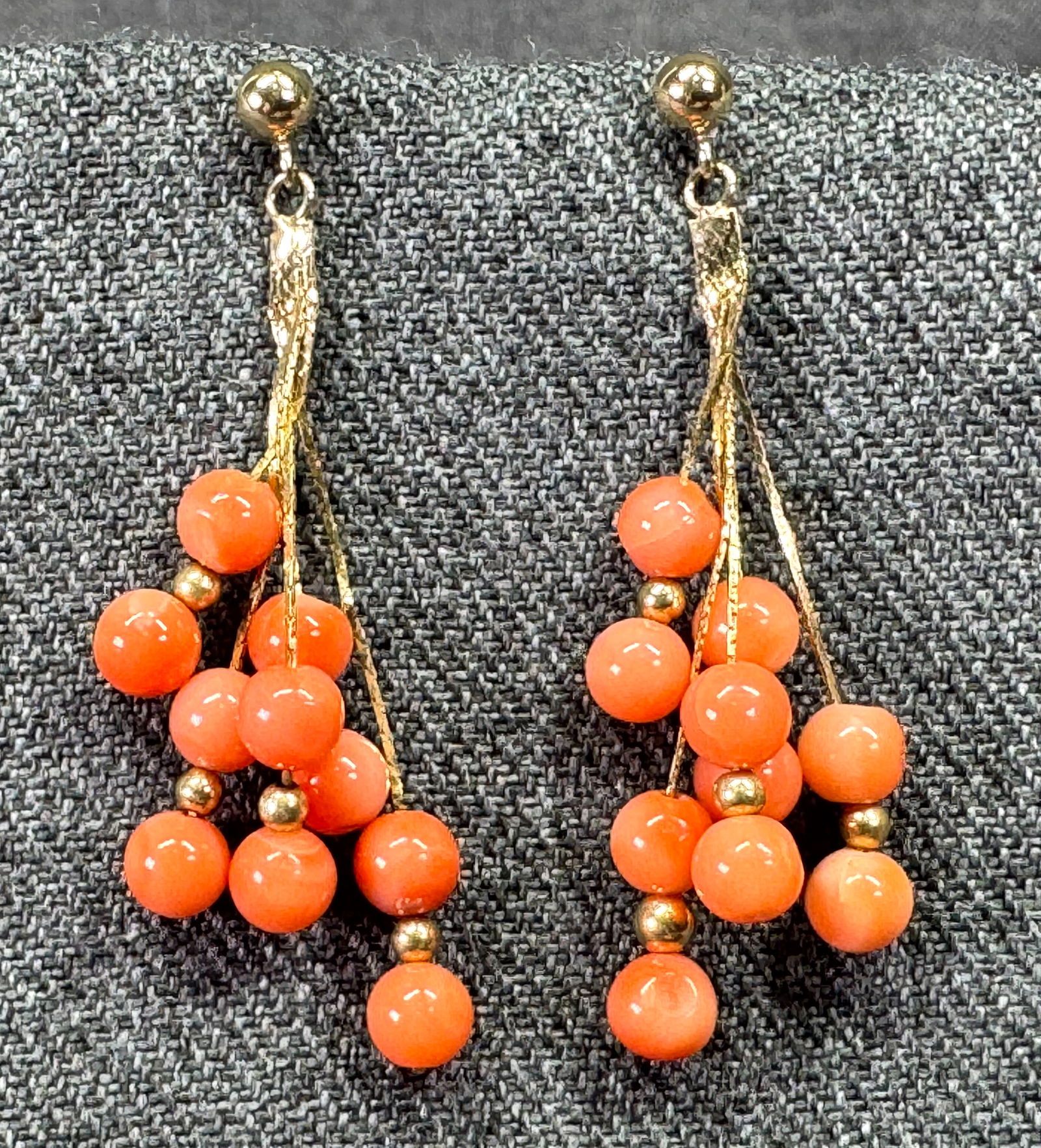 Vintage coral beads 14K yellow gold waterfall stud earrings: Vintage coral beads 14K yellow gold waterfall stud earrings. Marked 14K on posts. For measures please refer to the pictures taken with a measuring tape. Weight: 4.12 Grams. IN HOUSE Estimated* SHIPPIN