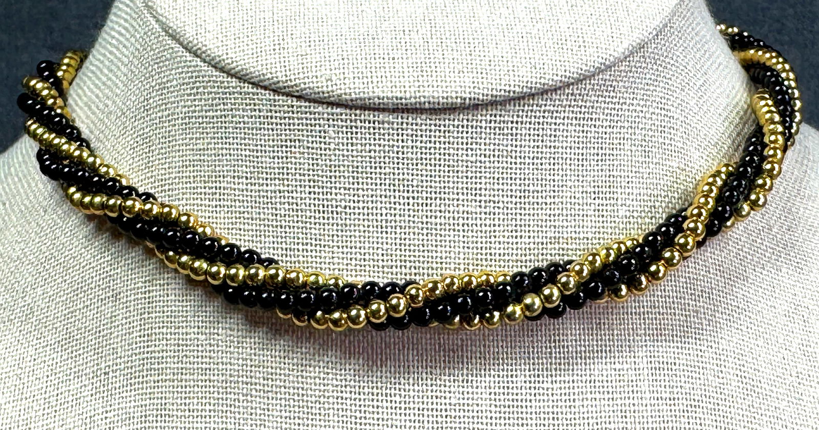 Vintage Talbots black lucite goldtoned metal woven collar necklace: Vintage Talbots black lucite goldtoned metal woven collar necklace. Marked. For measures please refer to the pictures taken with a measuring tape. Weight: 14 Grams. IN HOUSE Estimated* SHIPPING & HAND