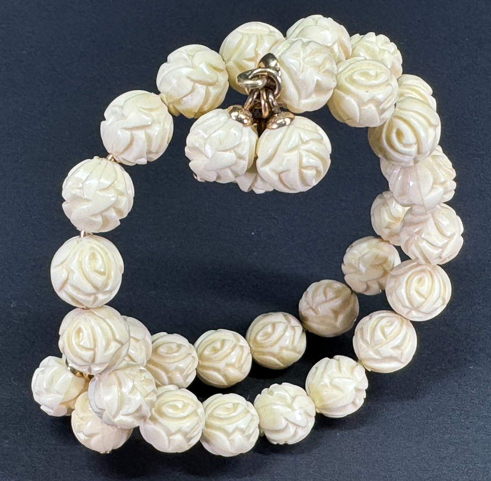 Vintage Napier wired creamy plastic flowers beads wrap bracelet with dangles.: Vintage Napier wired creamy plastic flowers beads wrap bracelet with dangles. Marked. For measures please refer to the pictures taken with a measuring tape. Weight: 24 Grams. This is a NO RESERVE AUCT