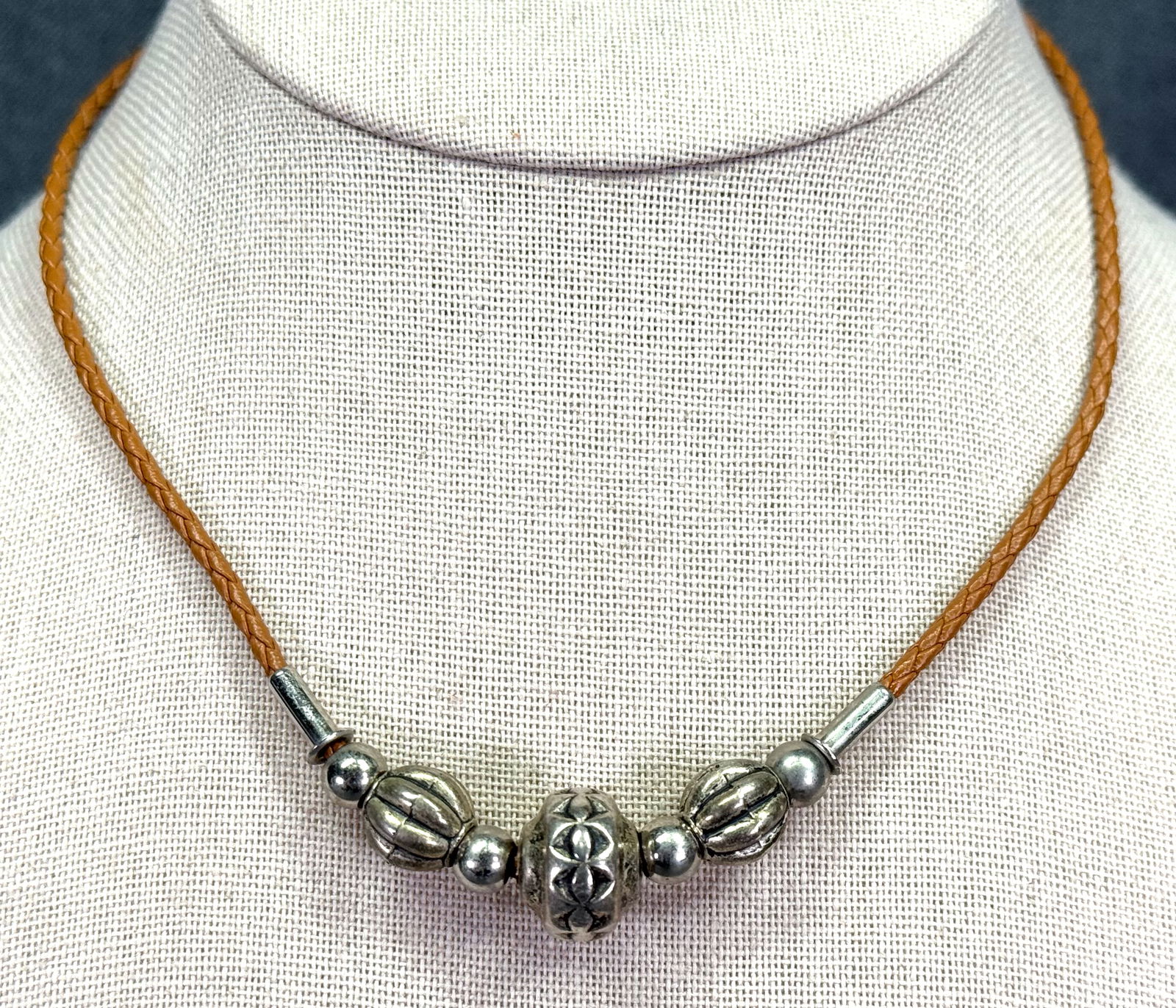 Vintage boho silvertoned metal beads braided strap collar necklace: Vintage boho silvertoned metal beads similar leather braided strap collar necklace. Unmarked. For measures please refer to the pictures taken with a measuring tape. Weight: 9 Grams. IN HOUSE Estimated