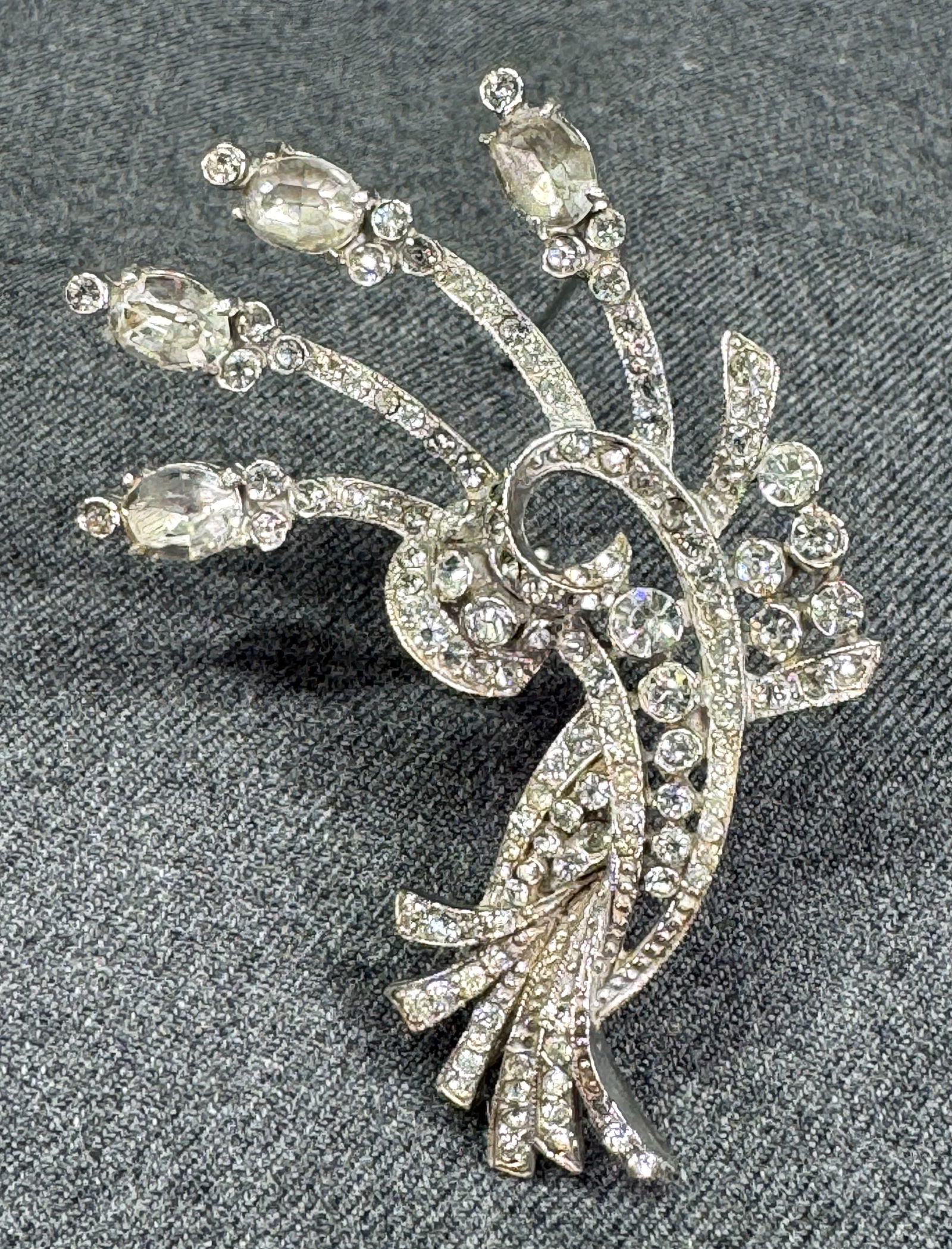 Vintage Alfred Philippe style crystals silvertone metal bouquet brooch pin: Vintage Alfred Philippe style crystals silvertone metal bouquet brooch pin. Unmarked. For measures please refer to the pictures taken with a measuring tape. Weight: 25 Grams. IN HOUSE Estimated* SHIPP